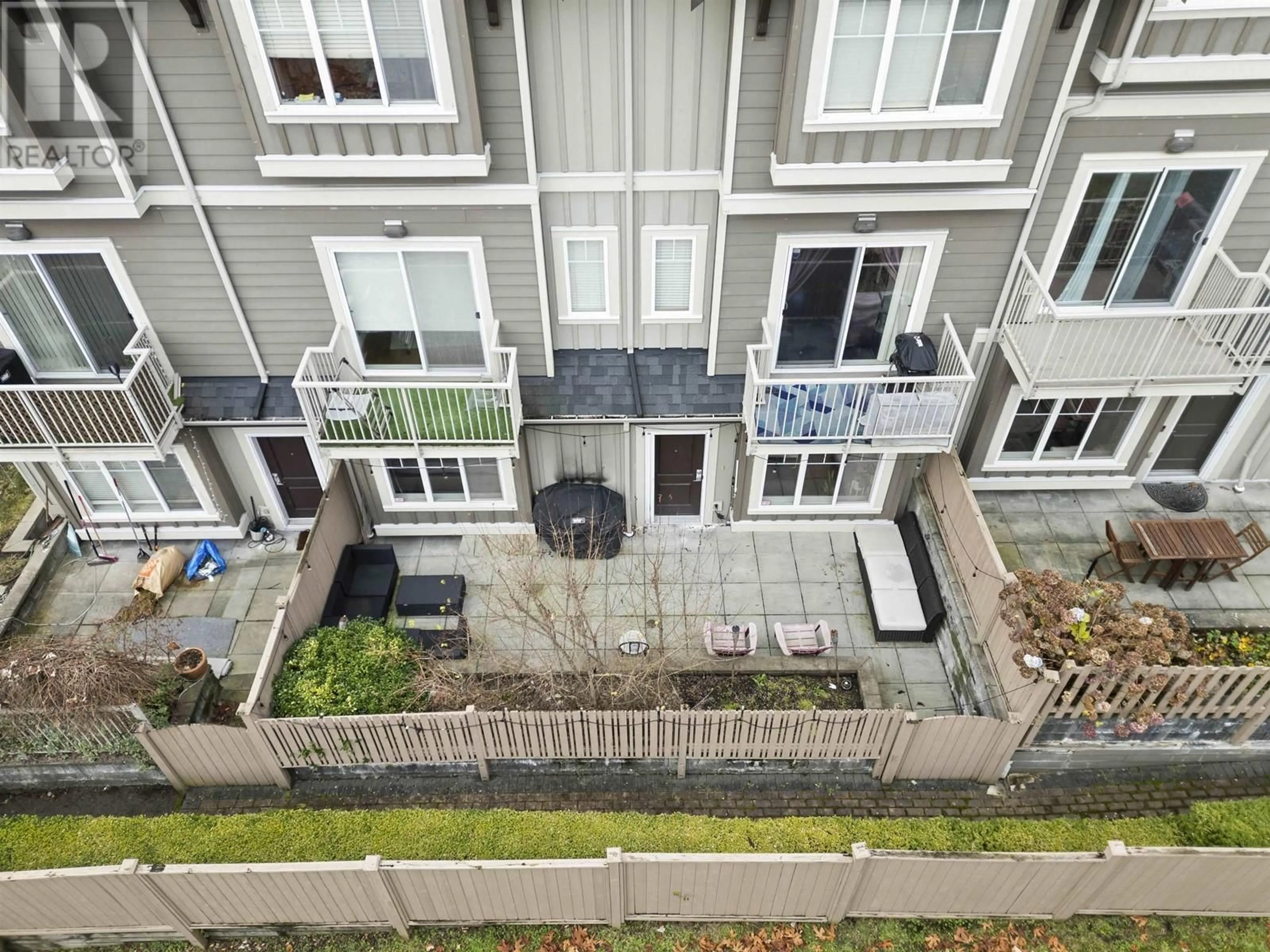 A pic from exterior of the house or condo, the fenced backyard for 110 368 ELLESMERE AVENUE, Burnaby British Columbia V5B3S9