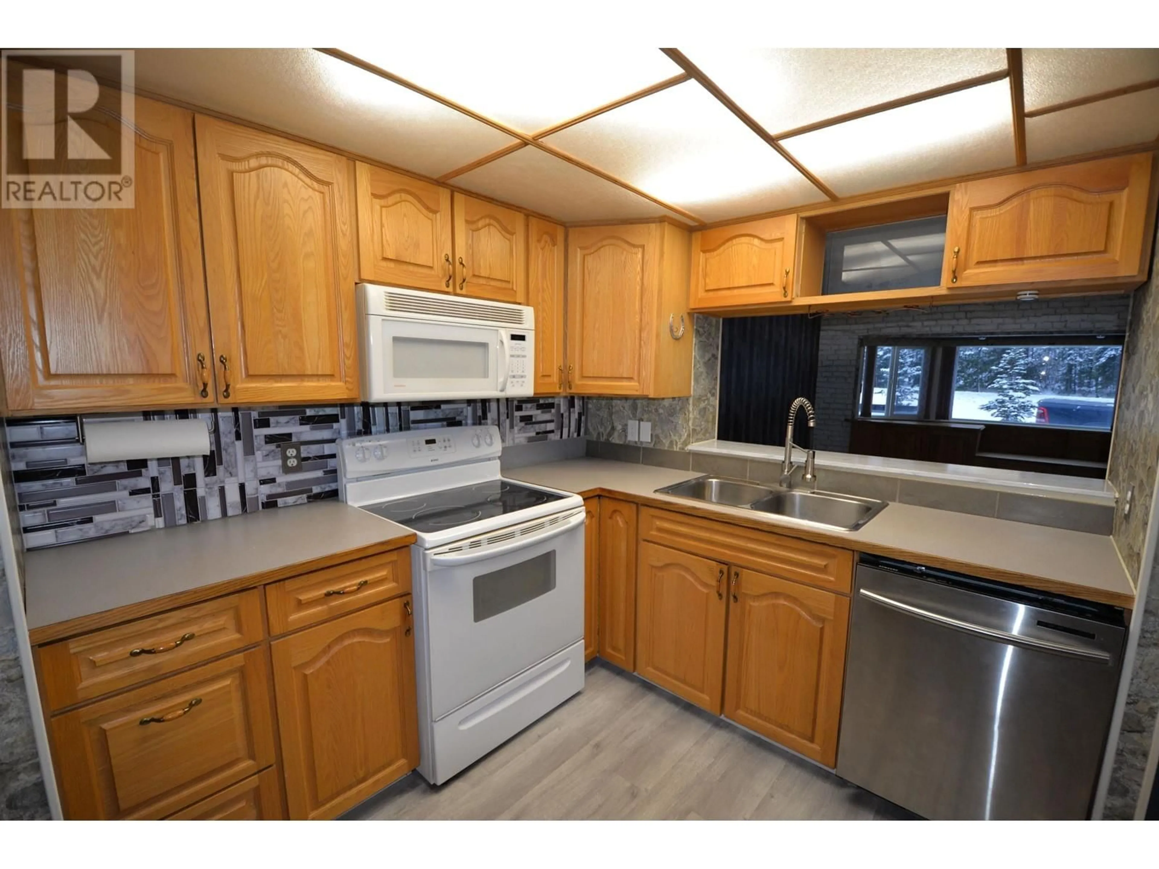 Standard kitchen, wood floors for 12 7128 OTWAY ROAD, Prince George British Columbia V2M7E1