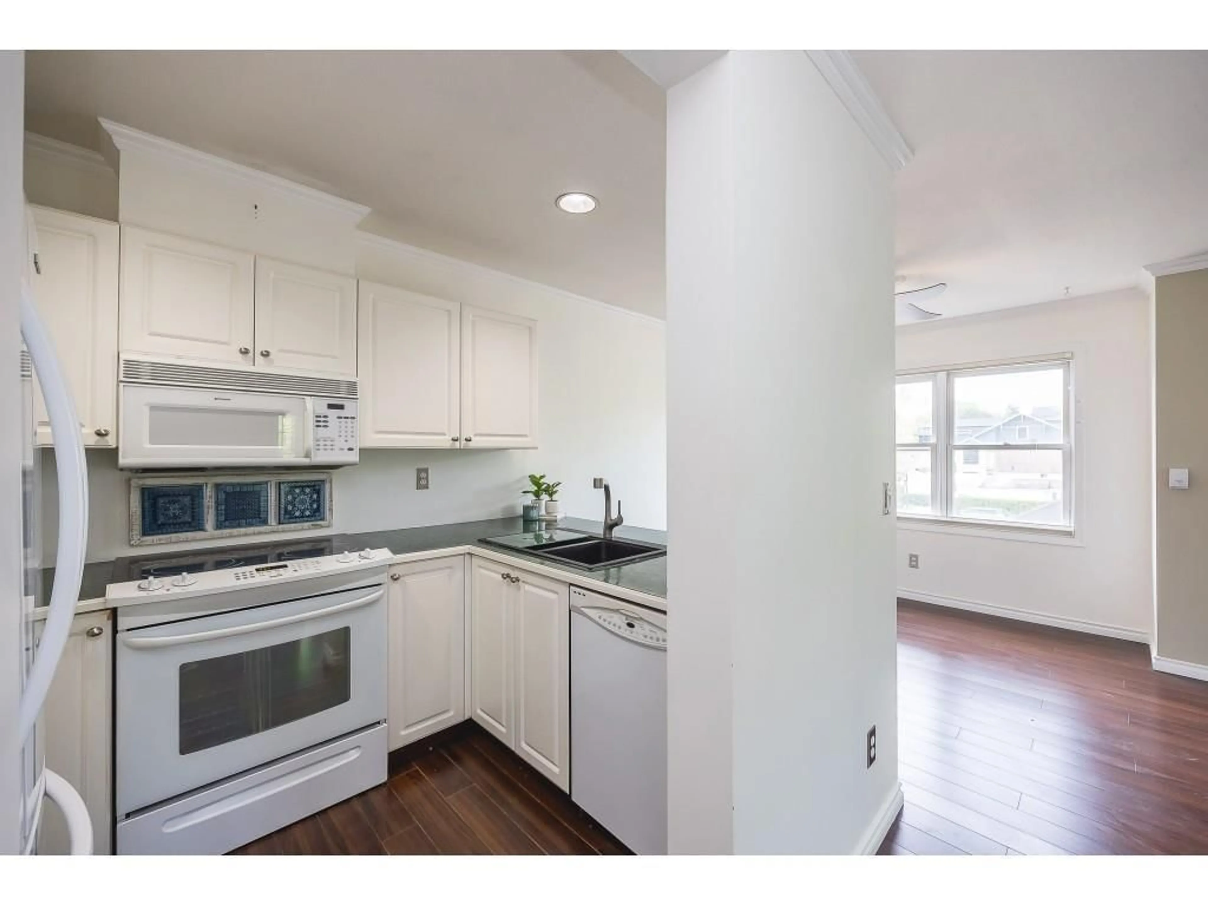 Standard kitchen, wood floors for 302 9124 GLOVER ROAD, Langley British Columbia V1M2R5