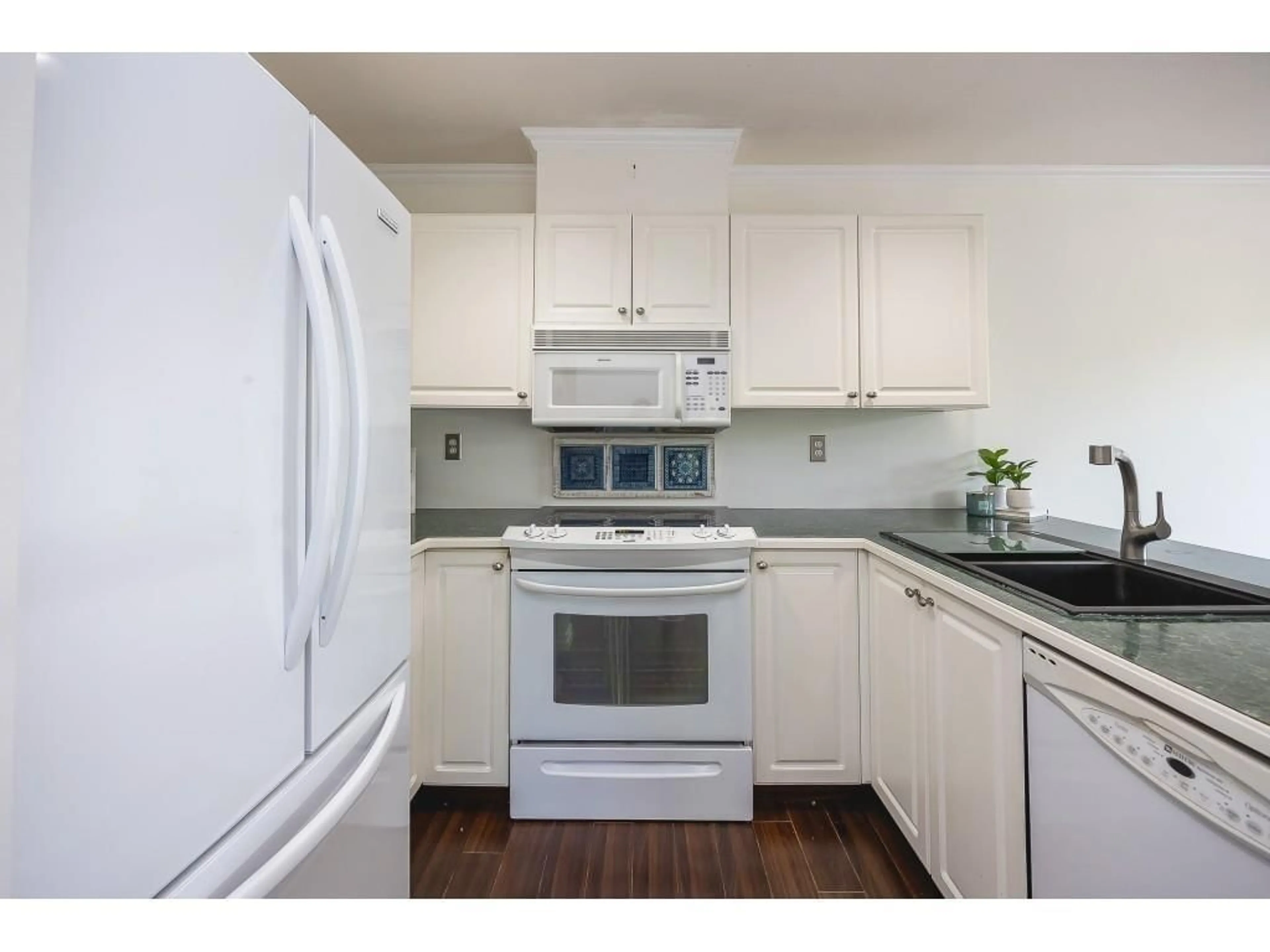 Standard kitchen, wood floors for 302 9124 GLOVER ROAD, Langley British Columbia V1M2R5