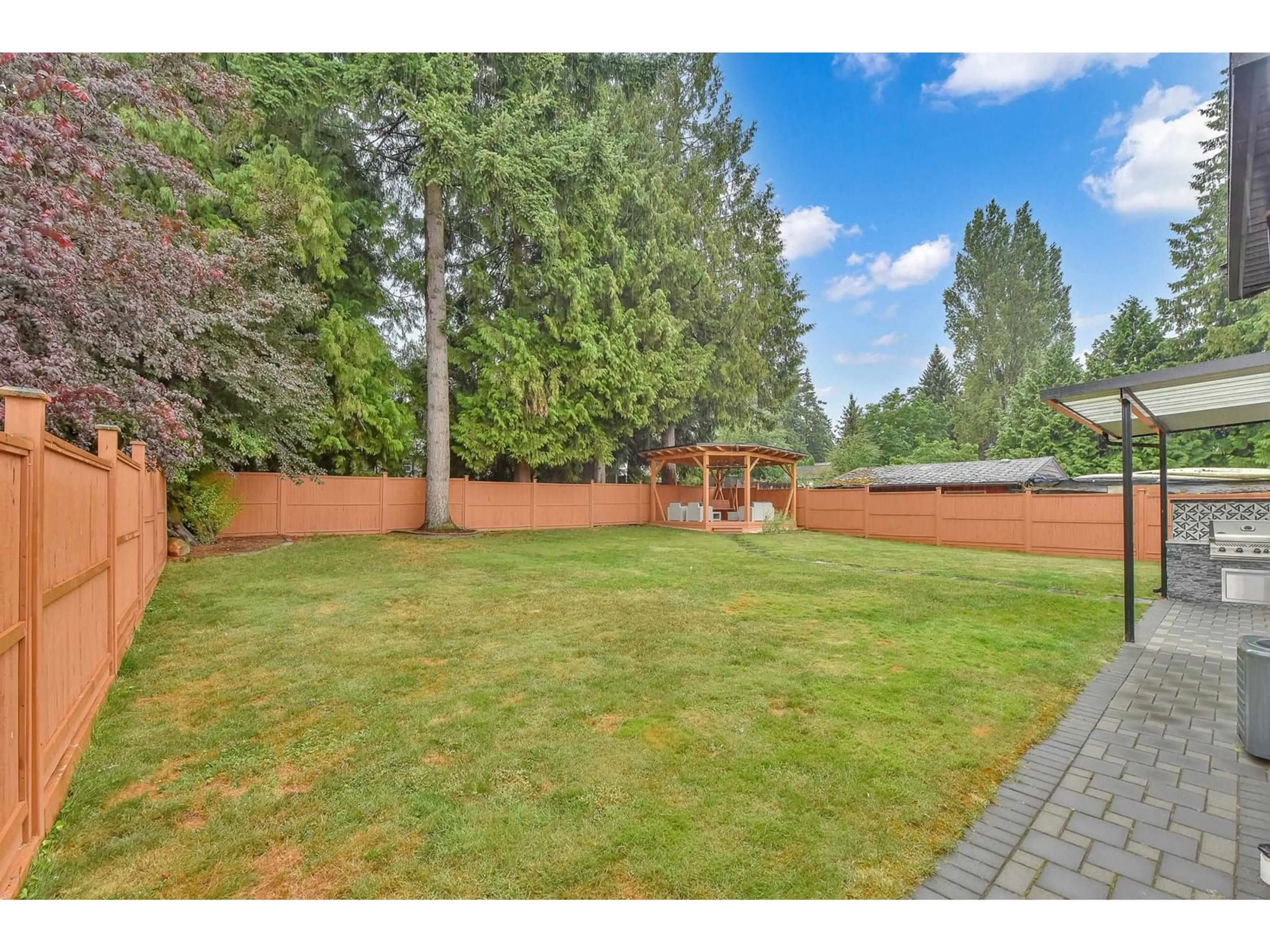 Patio, the fenced backyard for 10266 126 STREET, Surrey British Columbia V3V5E7