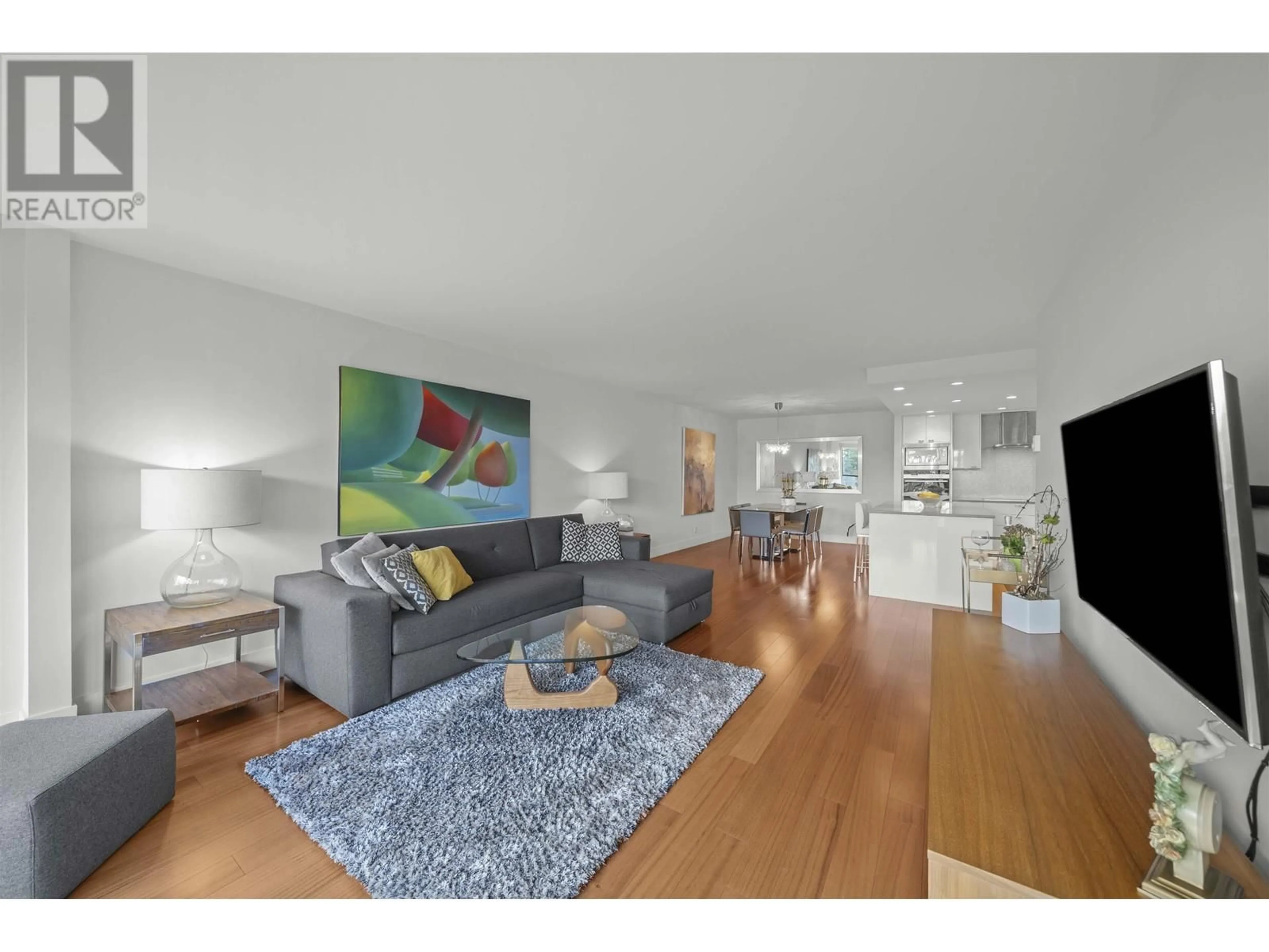 Living room, wood floors for 104 1470 PENNYFARTHING DRIVE, Vancouver British Columbia V6J4Y2