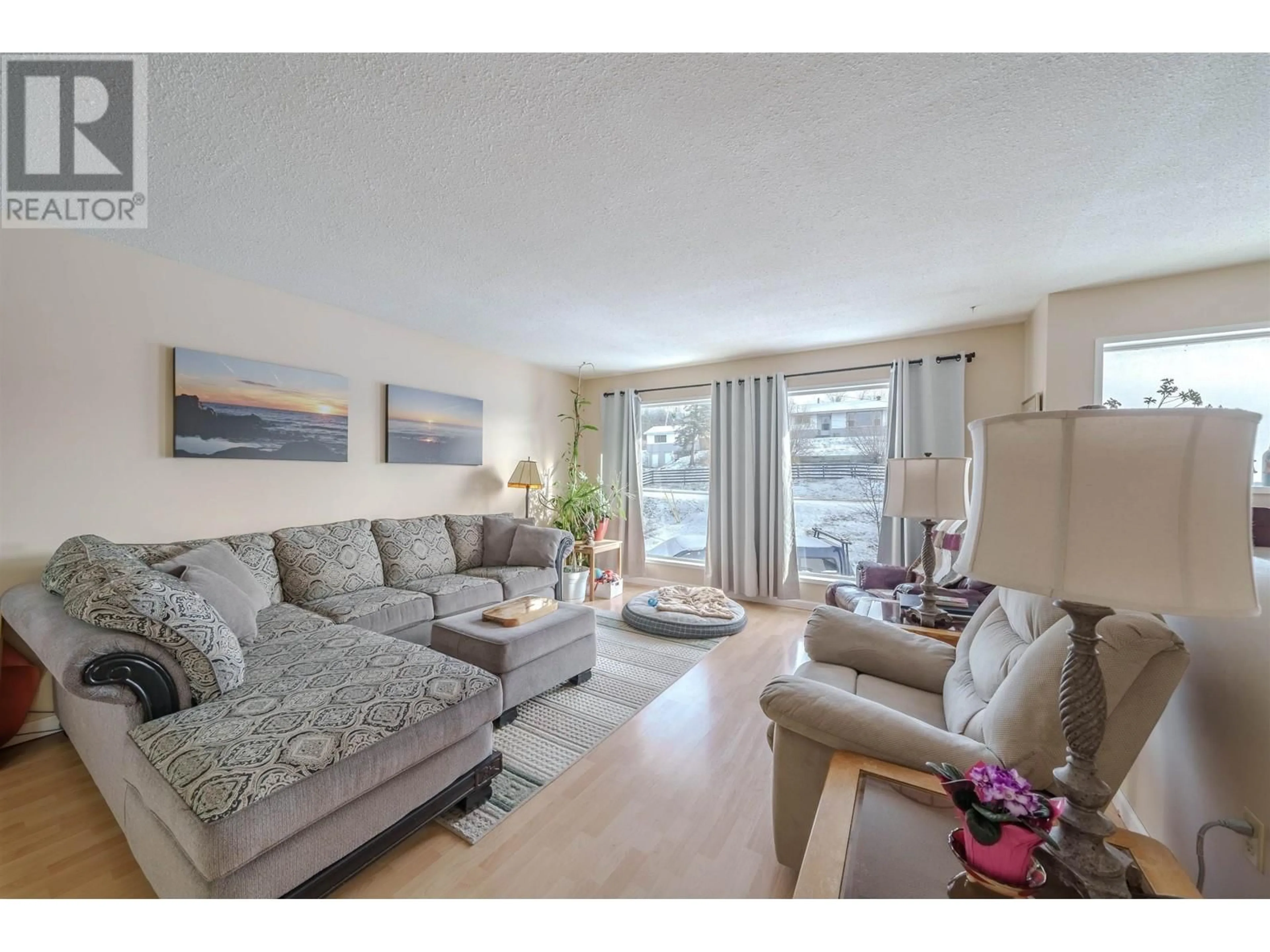 Living room, wood floors for 6118 REITA CRESCENT, 100 Mile House British Columbia V0K2E1