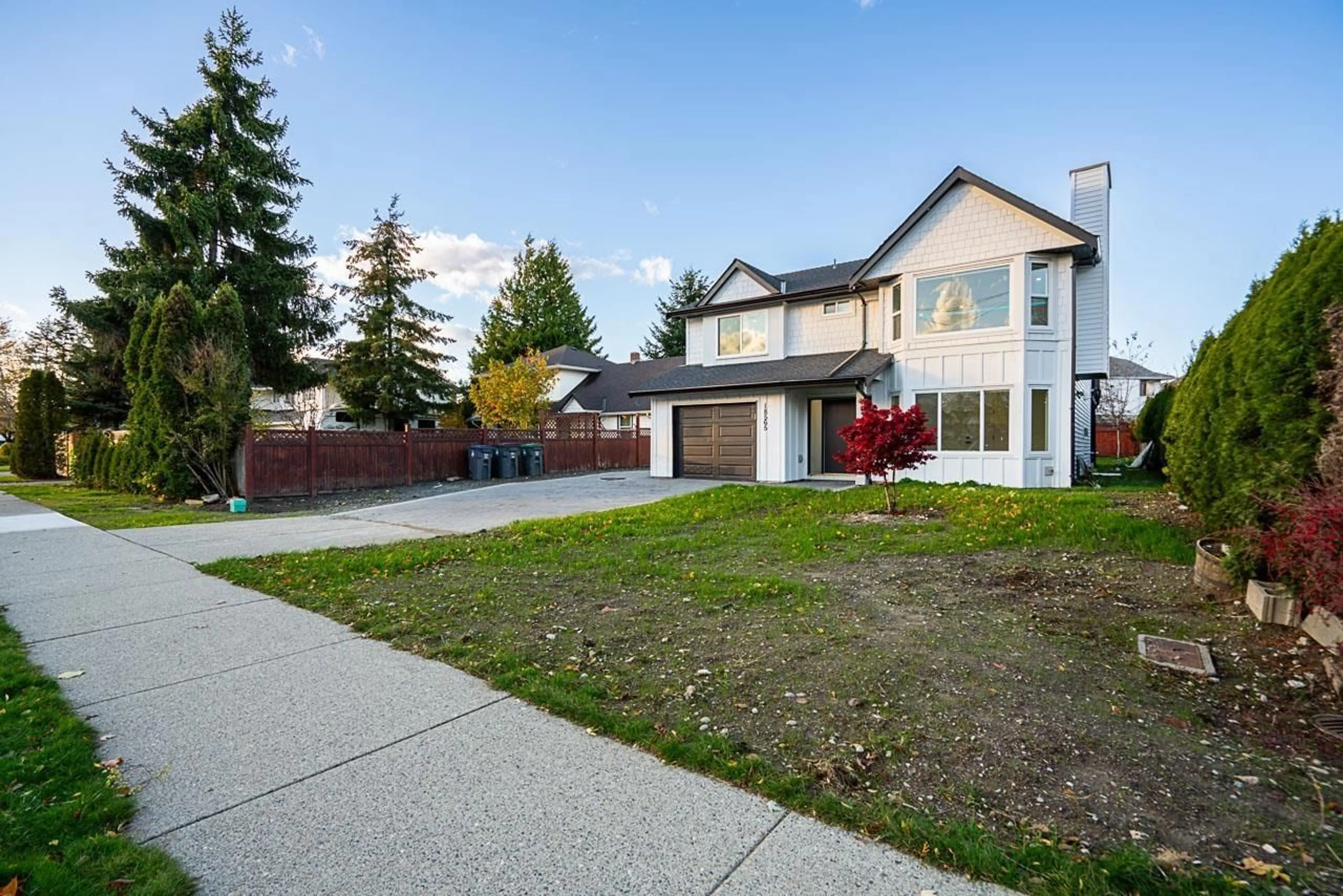 Frontside or backside of a home, the fenced backyard for 18565 60 AVENUE, Surrey British Columbia V3S8T6