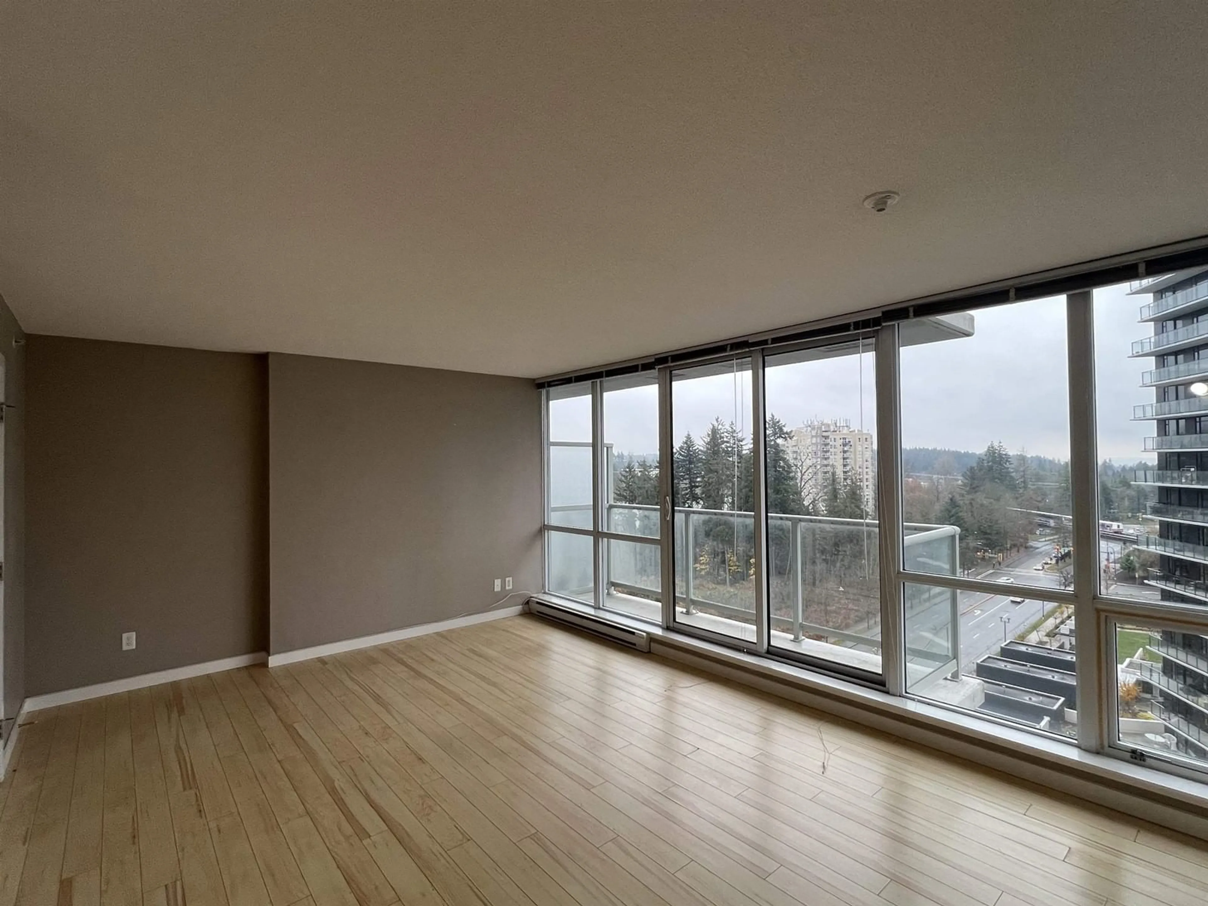 A pic of a room, wood floors for 1106 9981 WHALLEY BOULEVARD, Surrey British Columbia V3T0G6