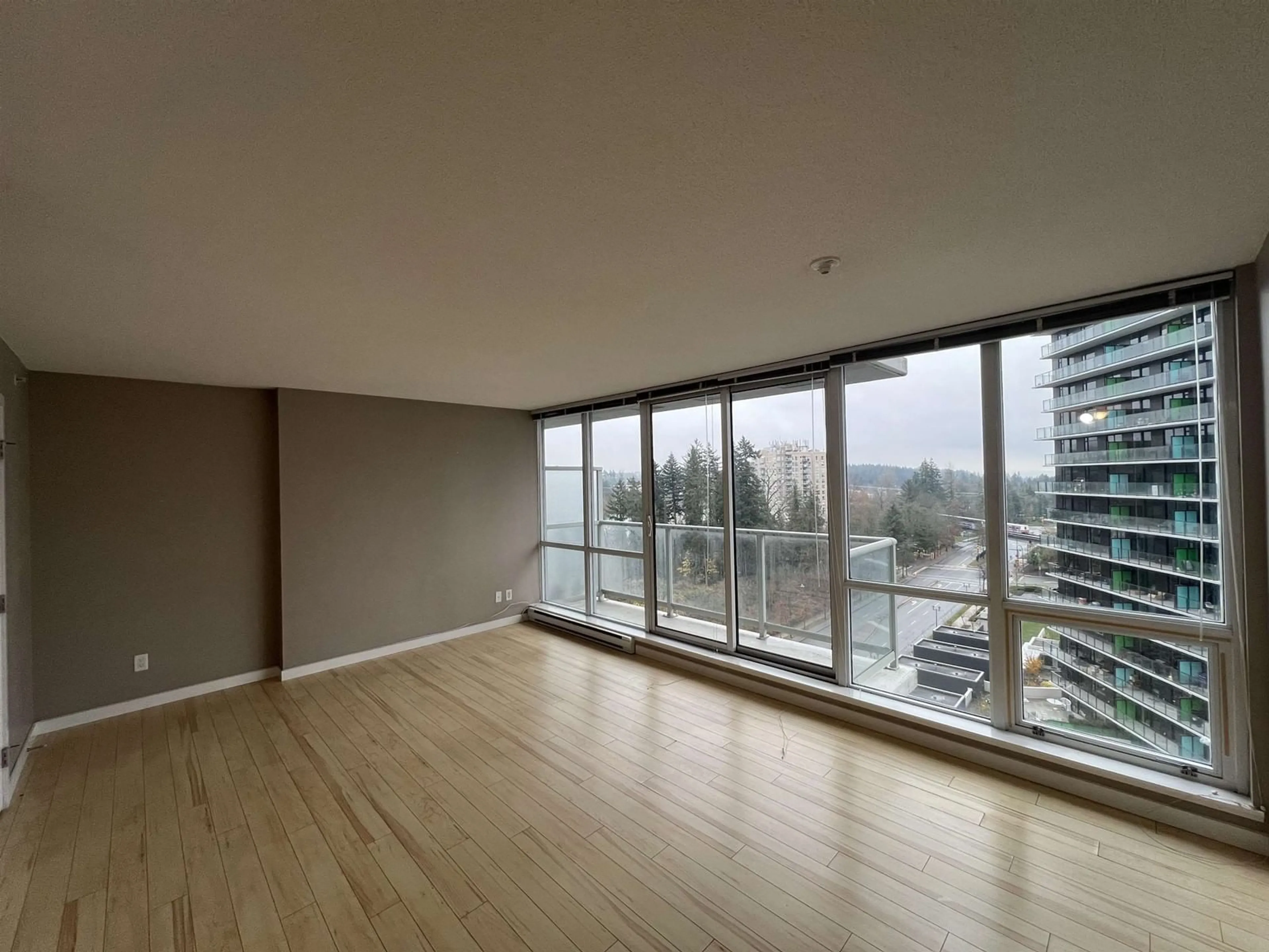 A pic of a room, wood floors for 1106 9981 WHALLEY BOULEVARD, Surrey British Columbia V3T0G6