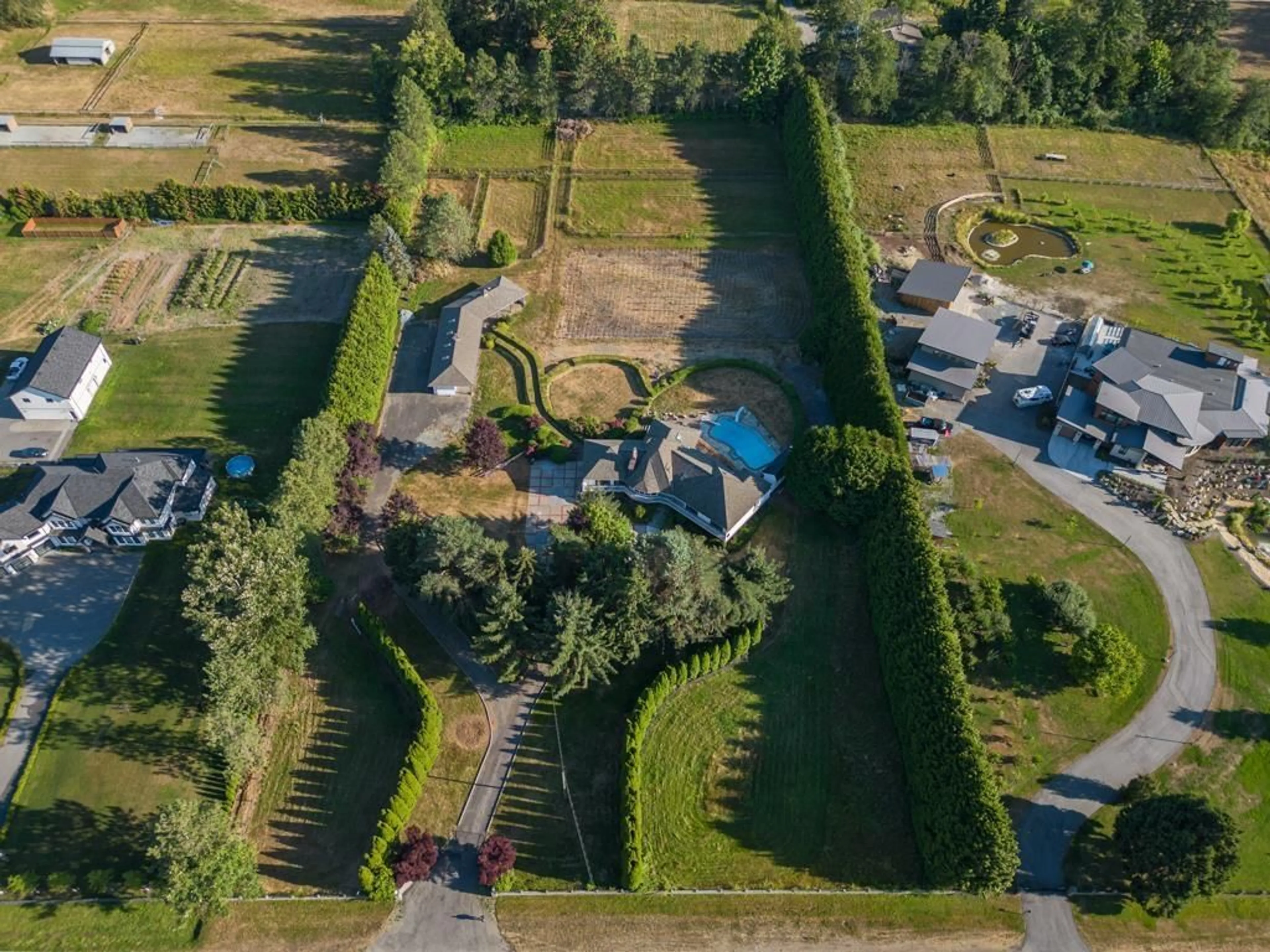 Frontside or backside of a home, the fenced backyard for 21480 18 AVENUE, Langley British Columbia V2Z2G1