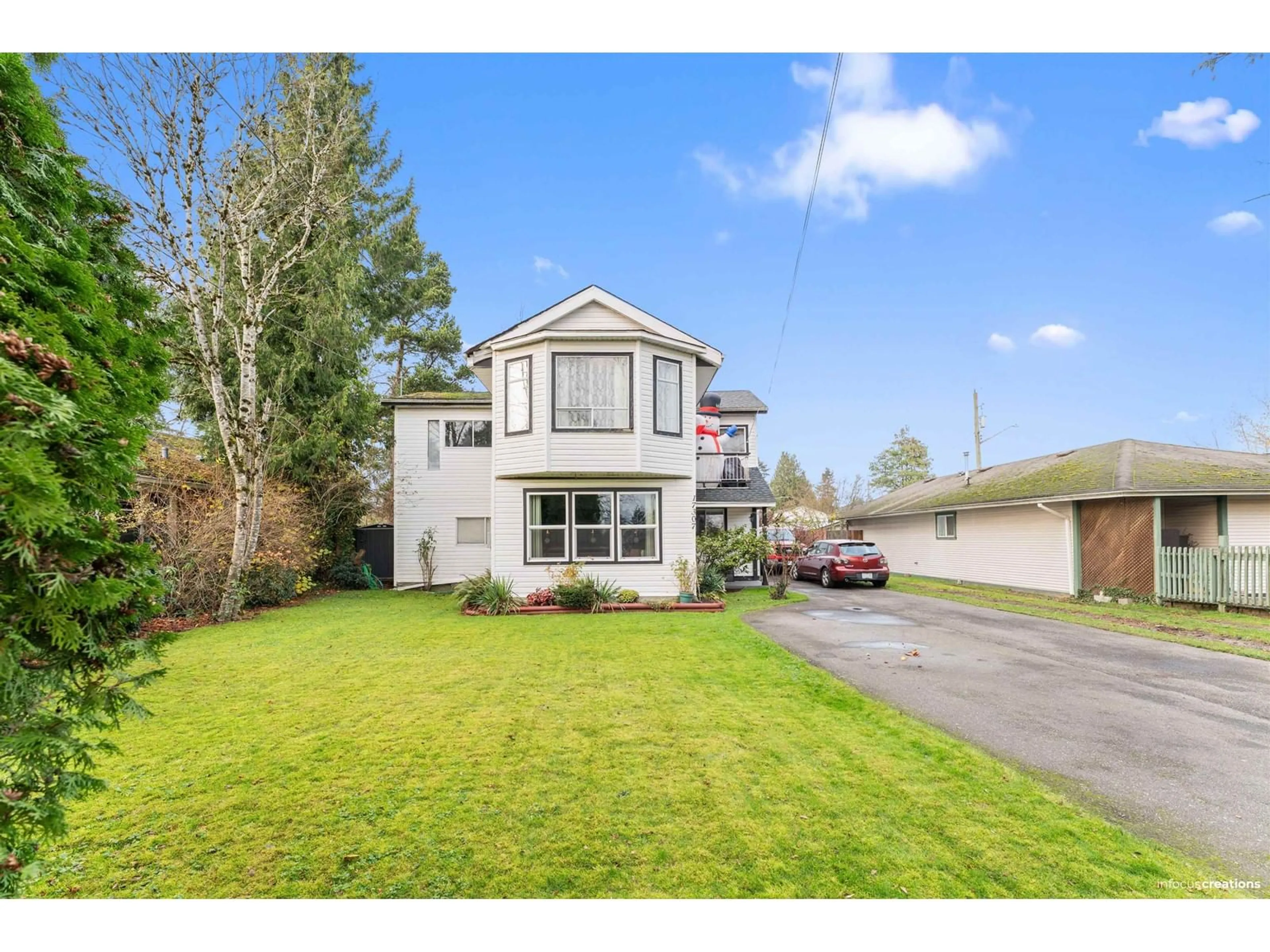 Frontside or backside of a home, the fenced backyard for 17307 58 AVENUE, Surrey British Columbia V3S1K7