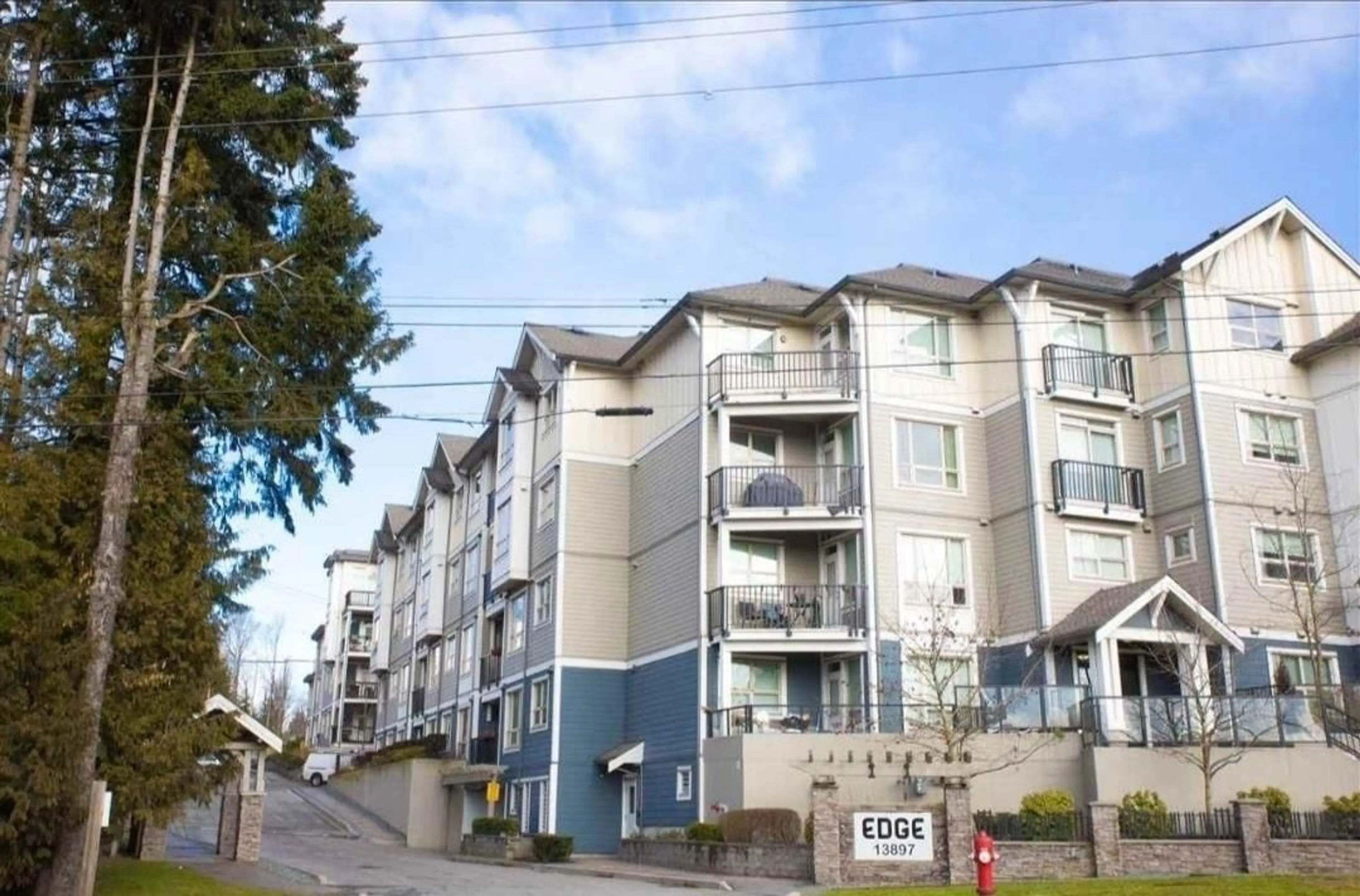 A pic from exterior of the house or condo, the front or back of building for 415 13897 FRASER HIGHWAY, Surrey British Columbia V3T0G8