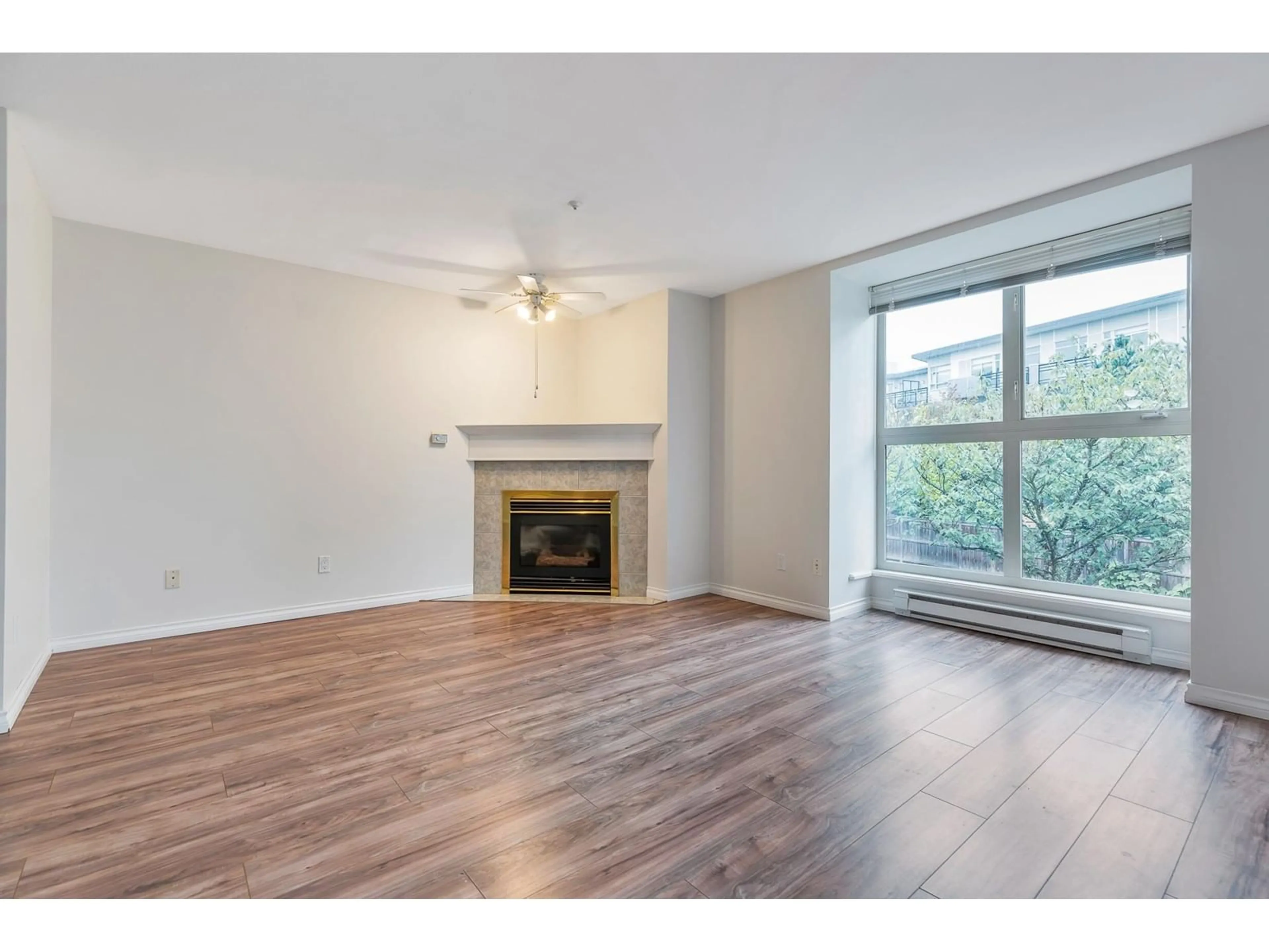 A pic of a room, wood floors for 209 10128 132 STREET, Surrey British Columbia V3T3T5