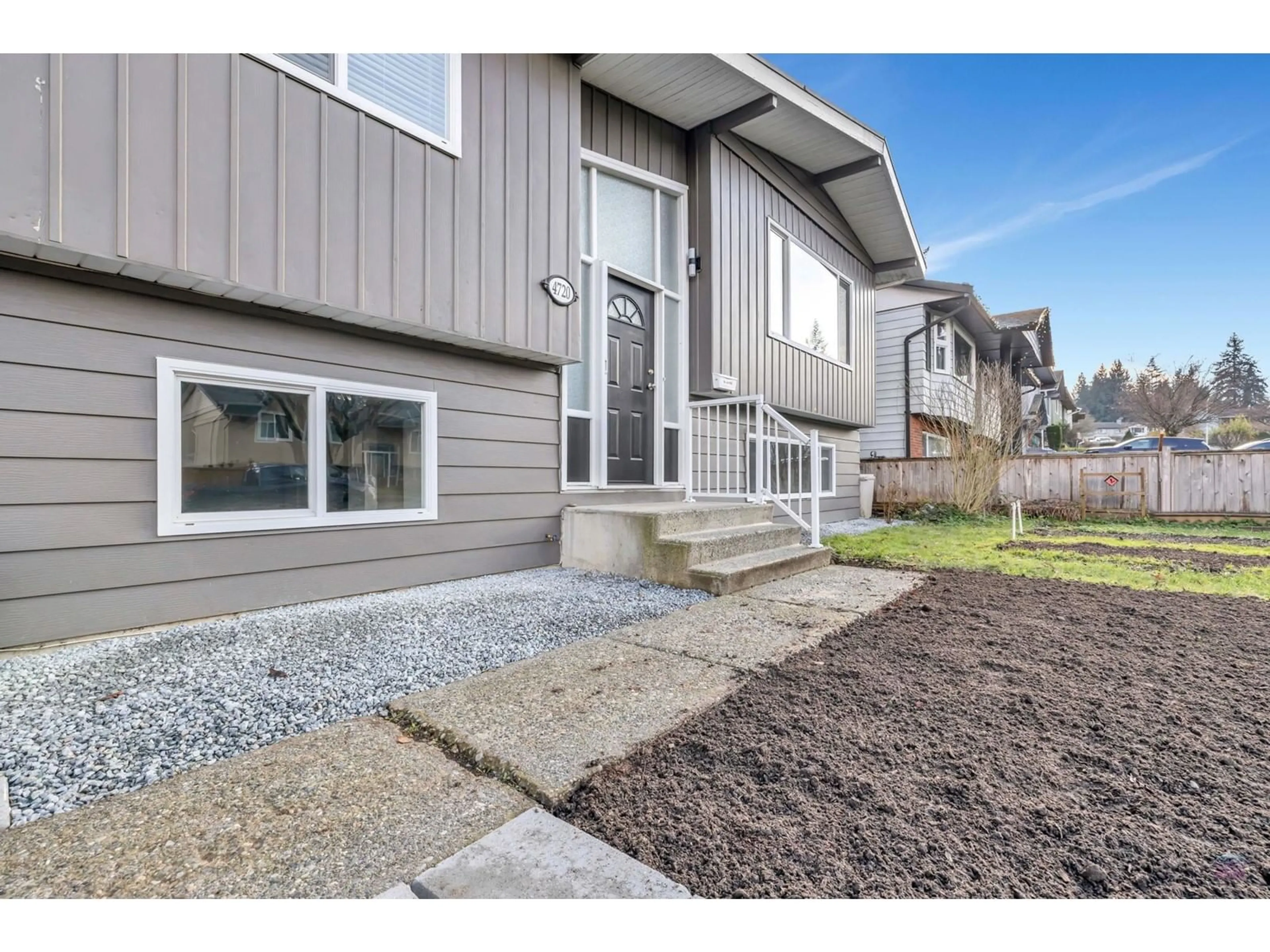 Frontside or backside of a home, the fenced backyard for 4720 203 STREET, Langley British Columbia V3A5J7