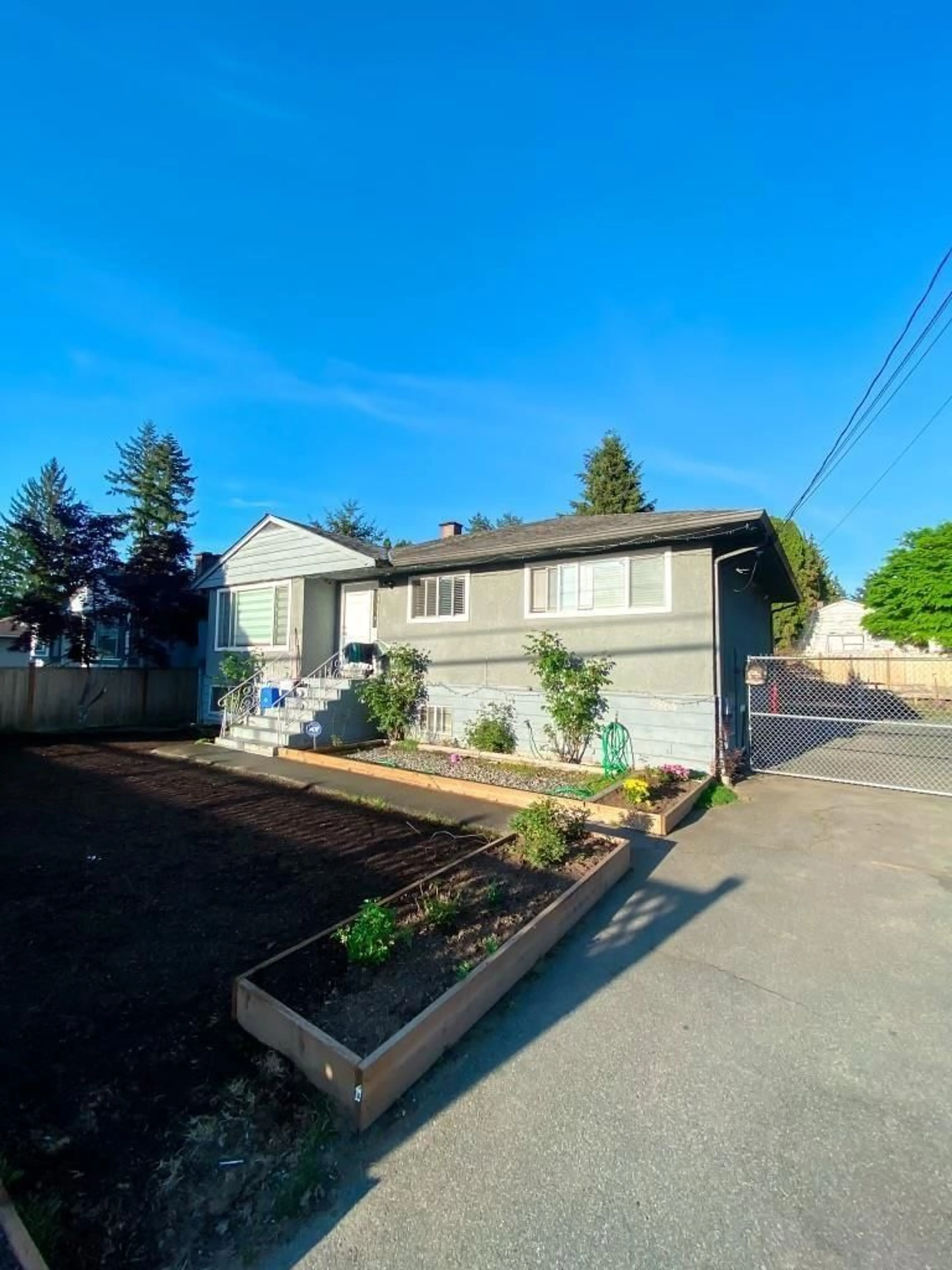 Frontside or backside of a home, the fenced backyard for 9864 128 STREET, Surrey British Columbia V3T2Y6