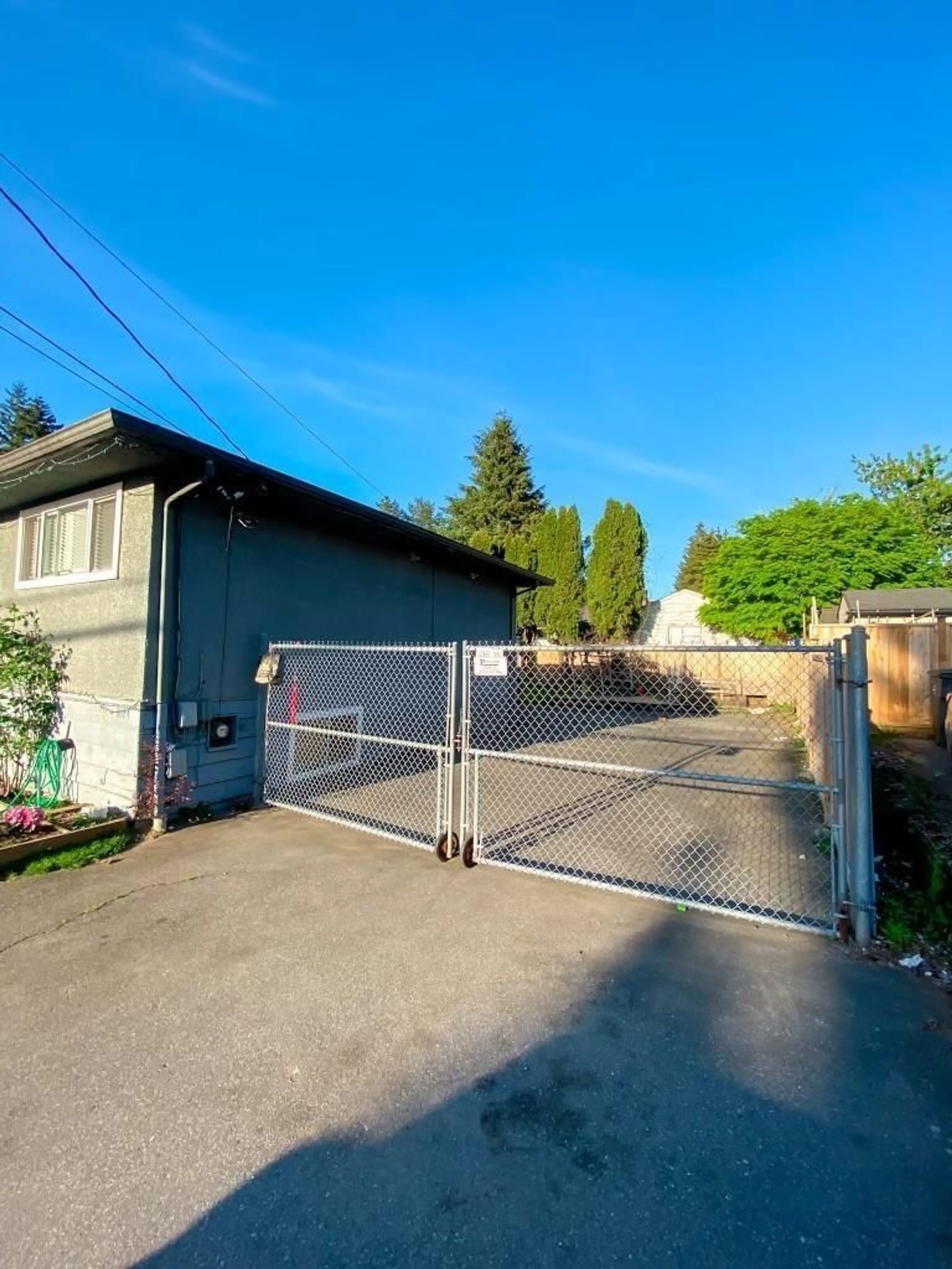 Frontside or backside of a home, the fenced backyard for 9864 128 STREET, Surrey British Columbia V3T2Y6