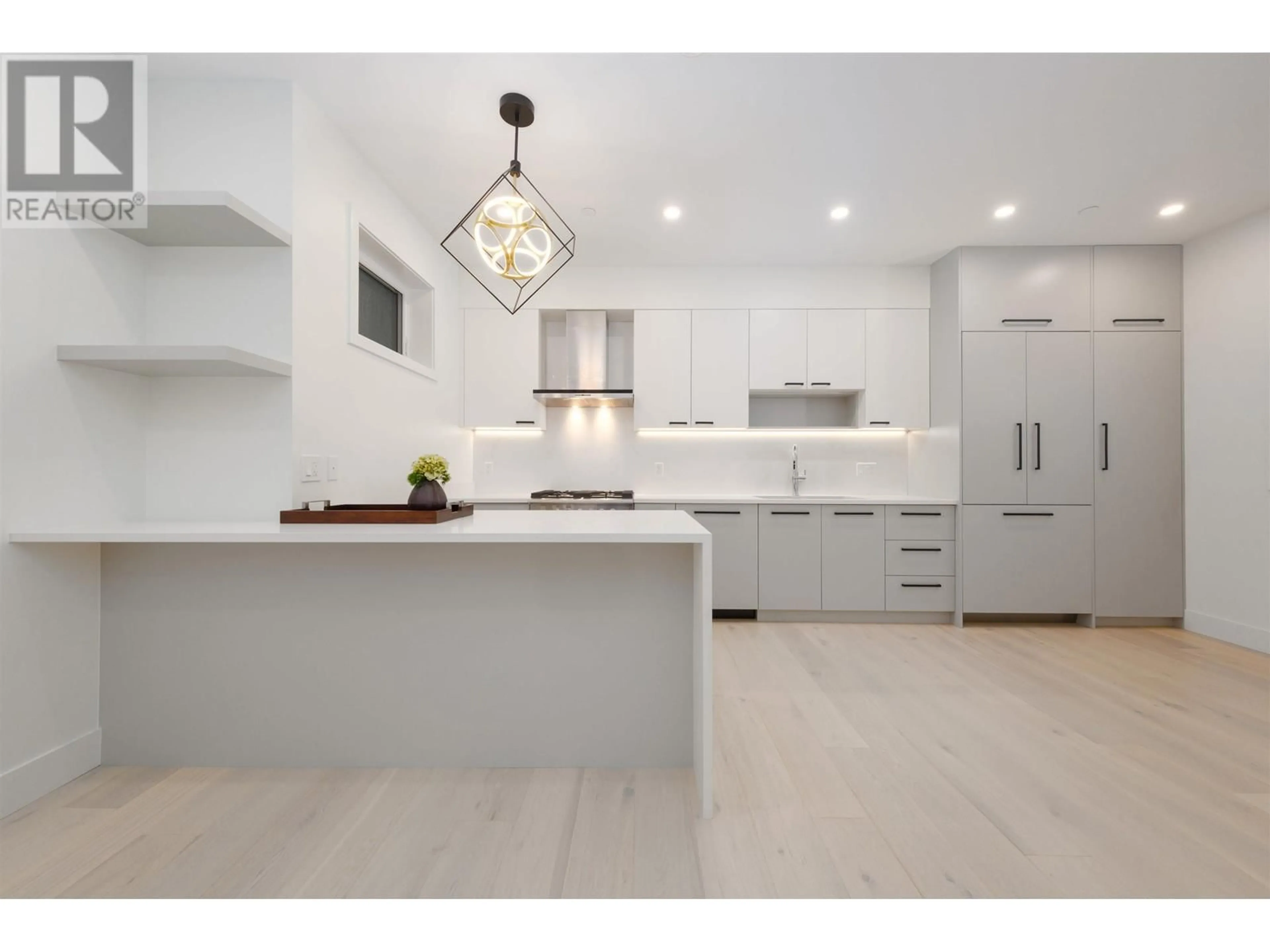 Contemporary kitchen, wood floors for 3172 W 26TH AVENUE, Vancouver British Columbia V6L1V8