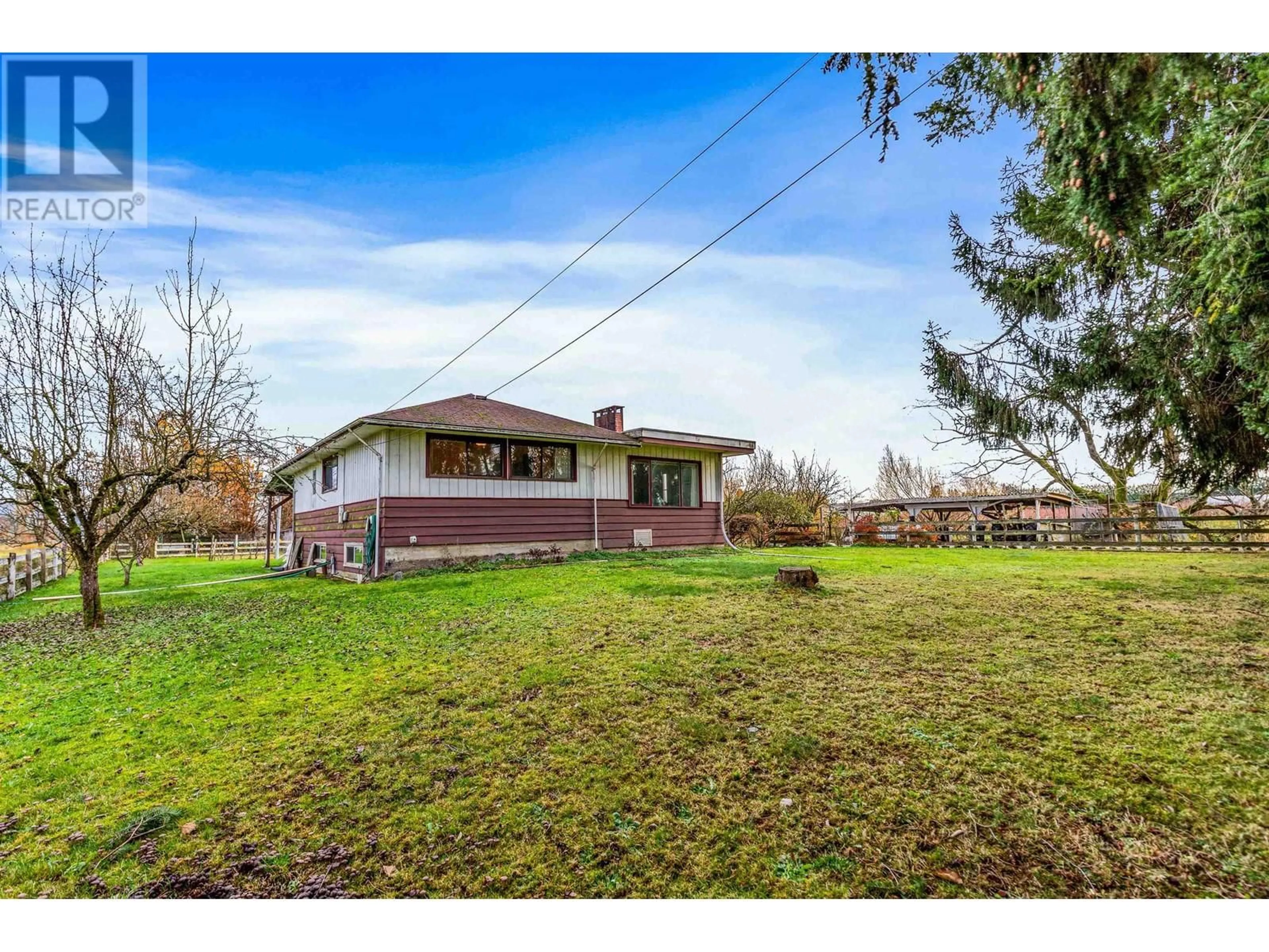 Frontside or backside of a home, the fenced backyard for 13448 REICHENBACH ROAD, Pitt Meadows British Columbia V3Y1Z1