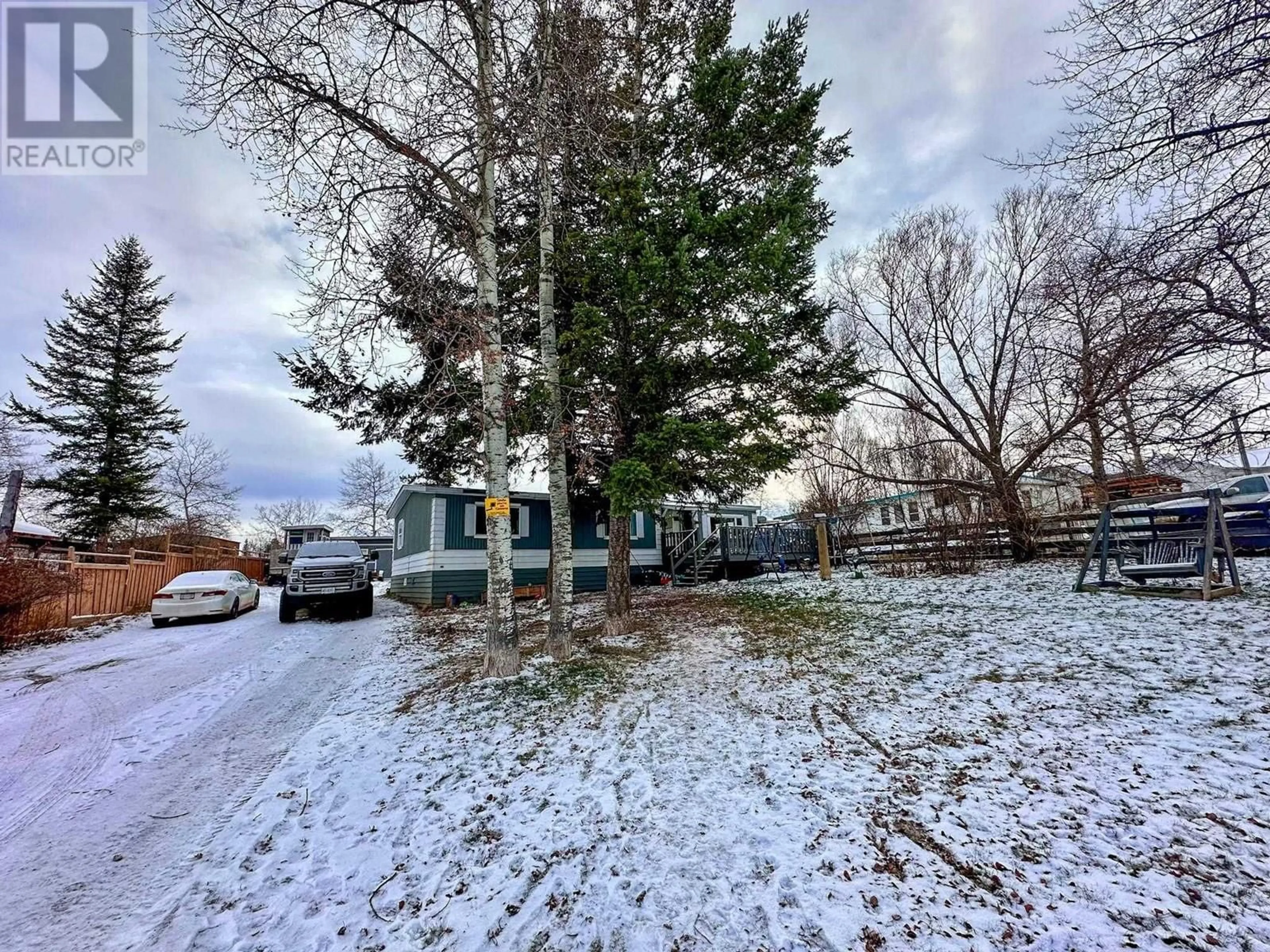 A pic from outside/outdoor area/front of a property/back of a property/a pic from drone, street for 5586 103 MILE LAKE ROAD, 103 Mile House British Columbia V0K2E1