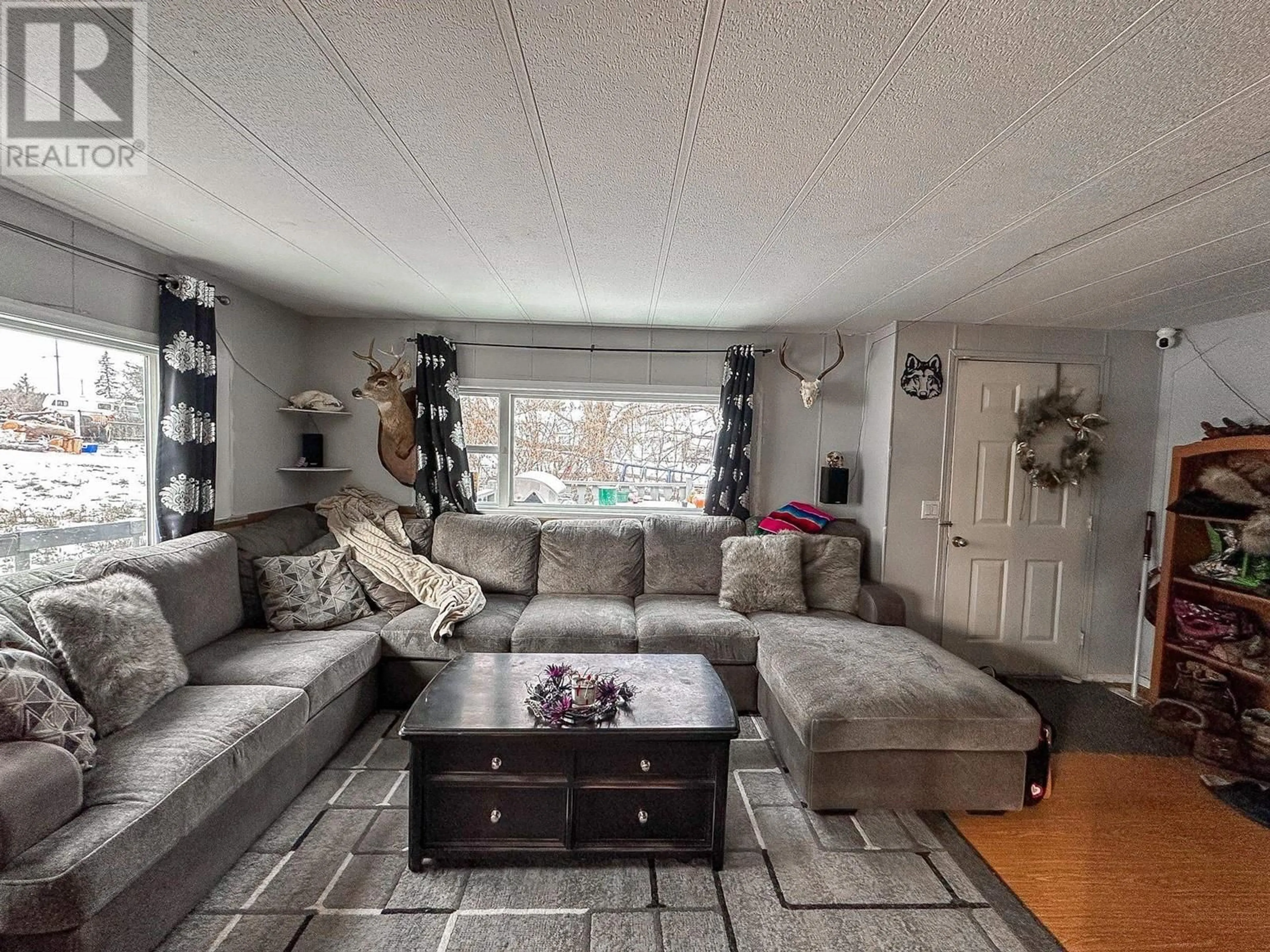Living room with furniture, unknown for 5586 103 MILE LAKE ROAD, 103 Mile House British Columbia V0K2E1