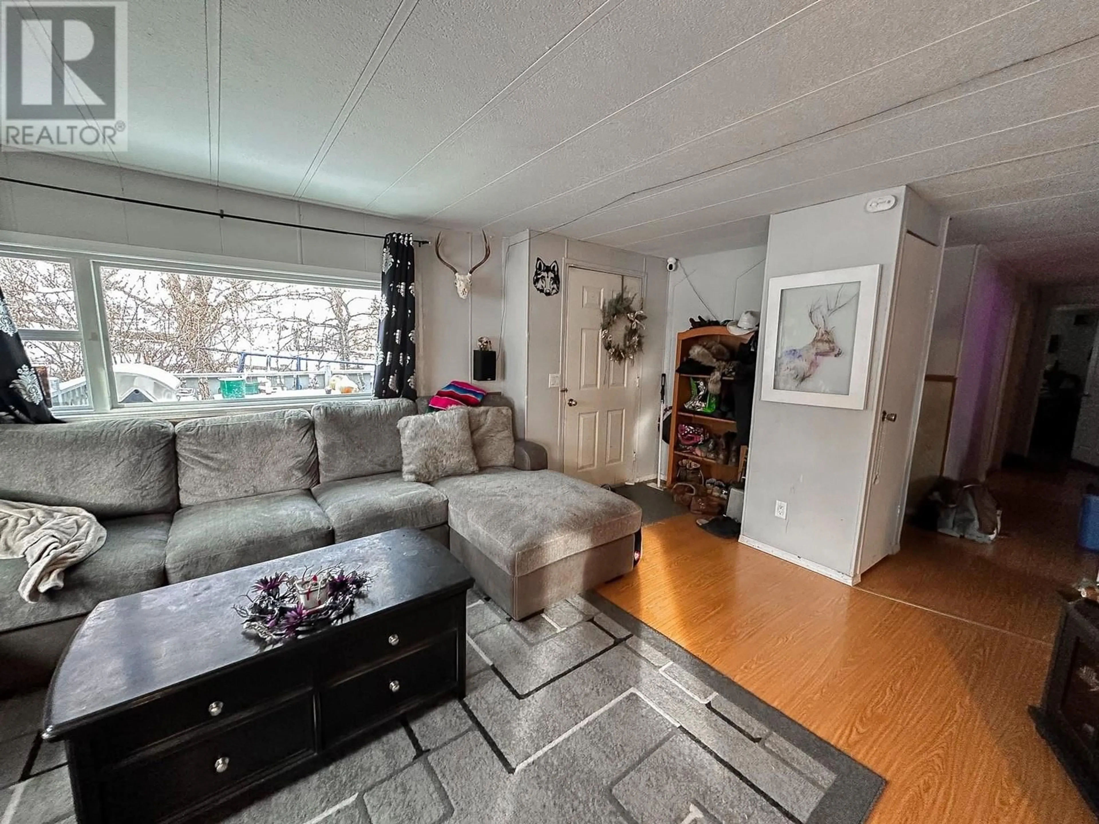 Living room with furniture, unknown for 5586 103 MILE LAKE ROAD, 103 Mile House British Columbia V0K2E1