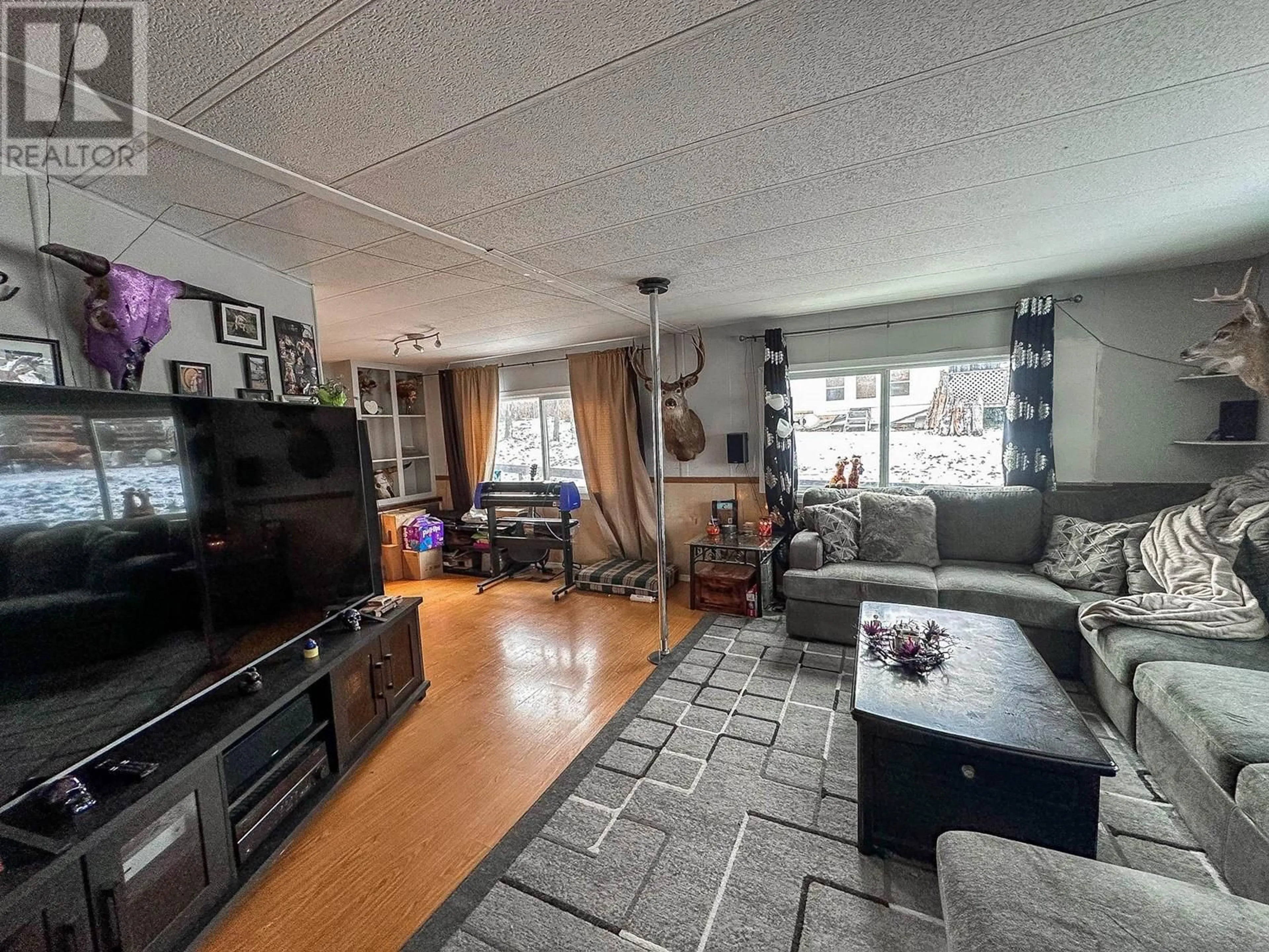 Living room with furniture, unknown for 5586 103 MILE LAKE ROAD, 103 Mile House British Columbia V0K2E1