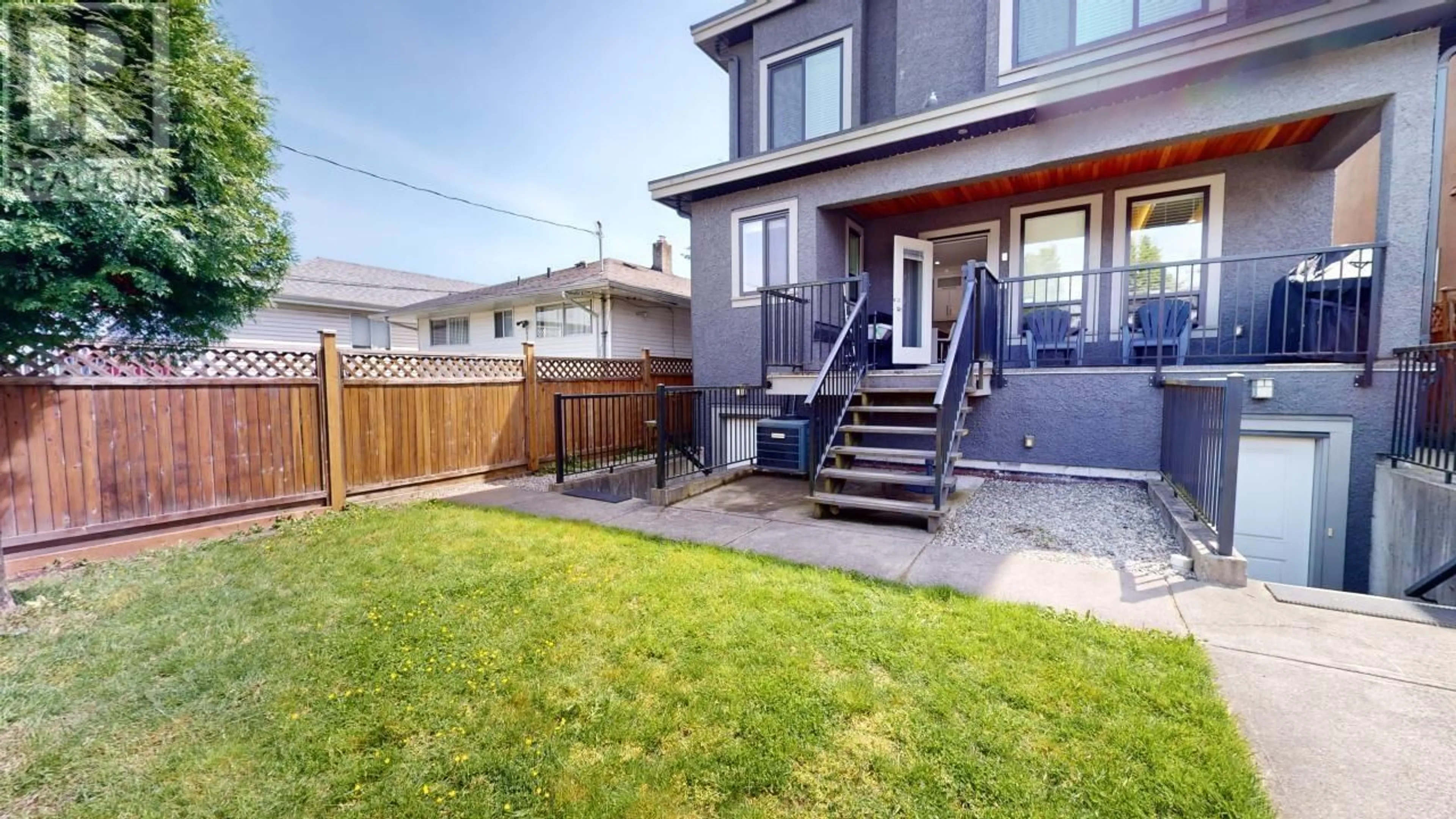 Frontside or backside of a home, the fenced backyard for 3317 E 3RD AVENUE, Vancouver British Columbia V5M1J5