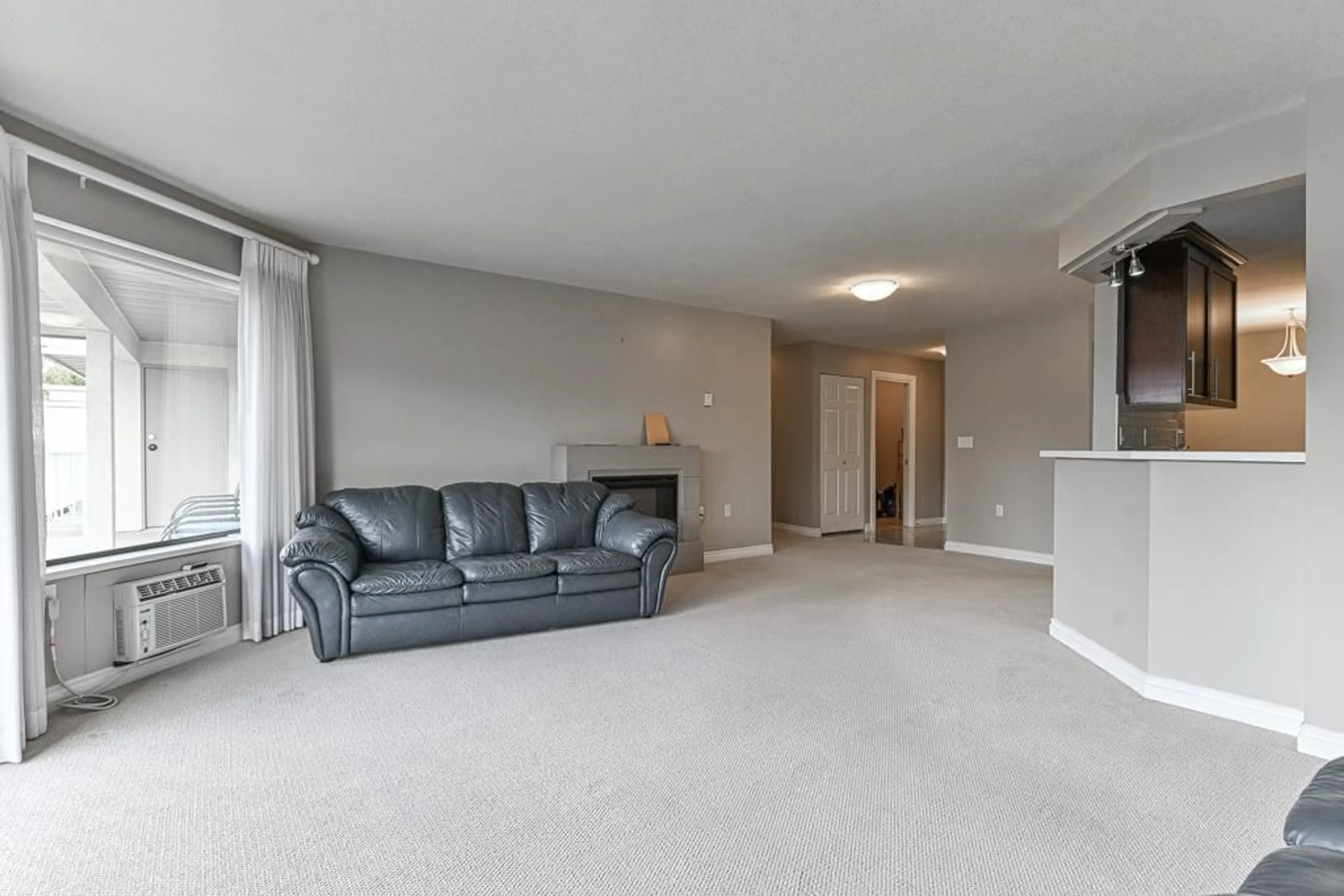 A pic of a room, carpet floors for 207 33233 BOURQUIN CRESCENT, Abbotsford British Columbia V2S1Y2