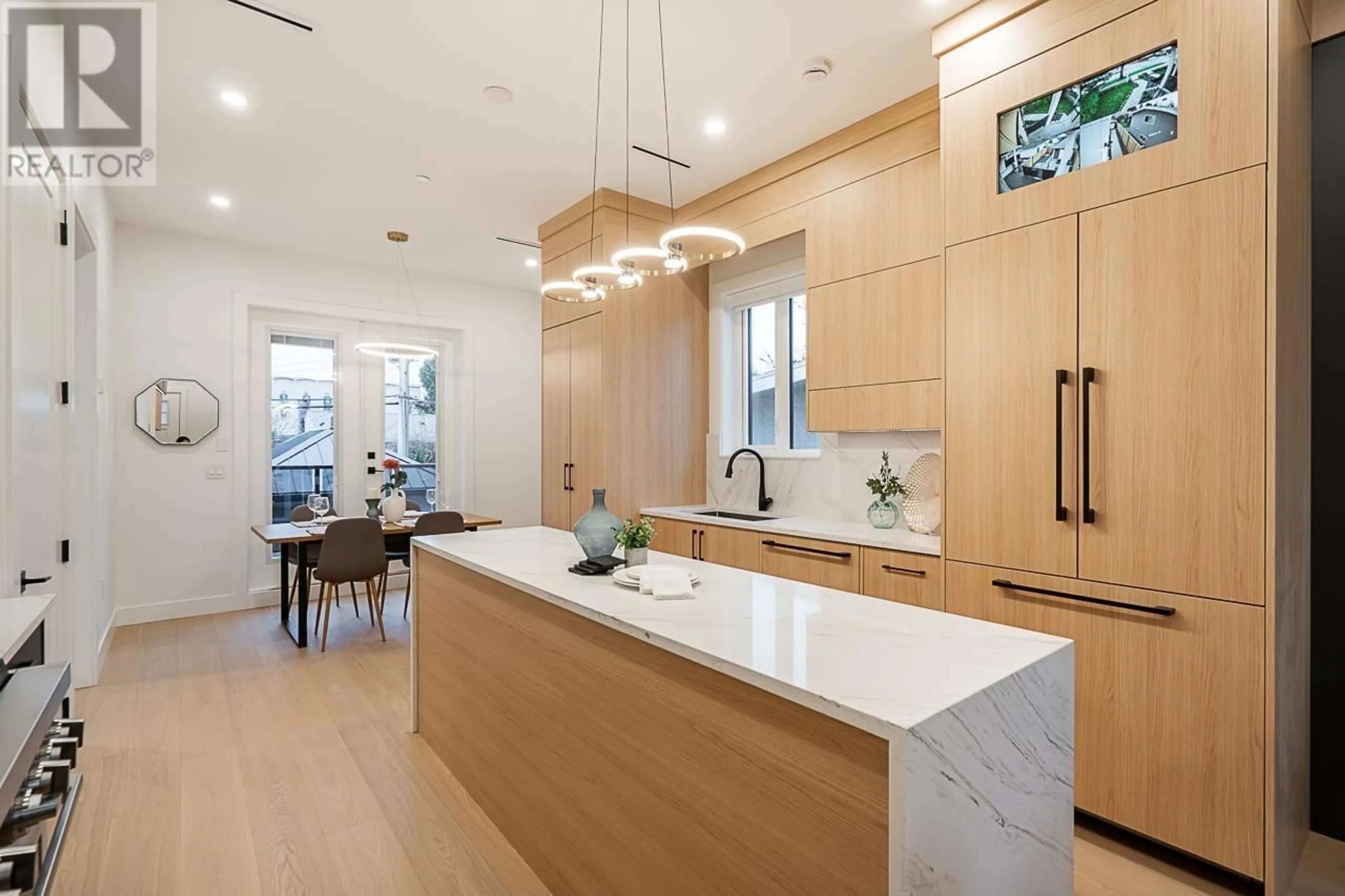 Contemporary kitchen, wood floors for 2331 E 49TH AVENUE, Vancouver British Columbia V5S1J3