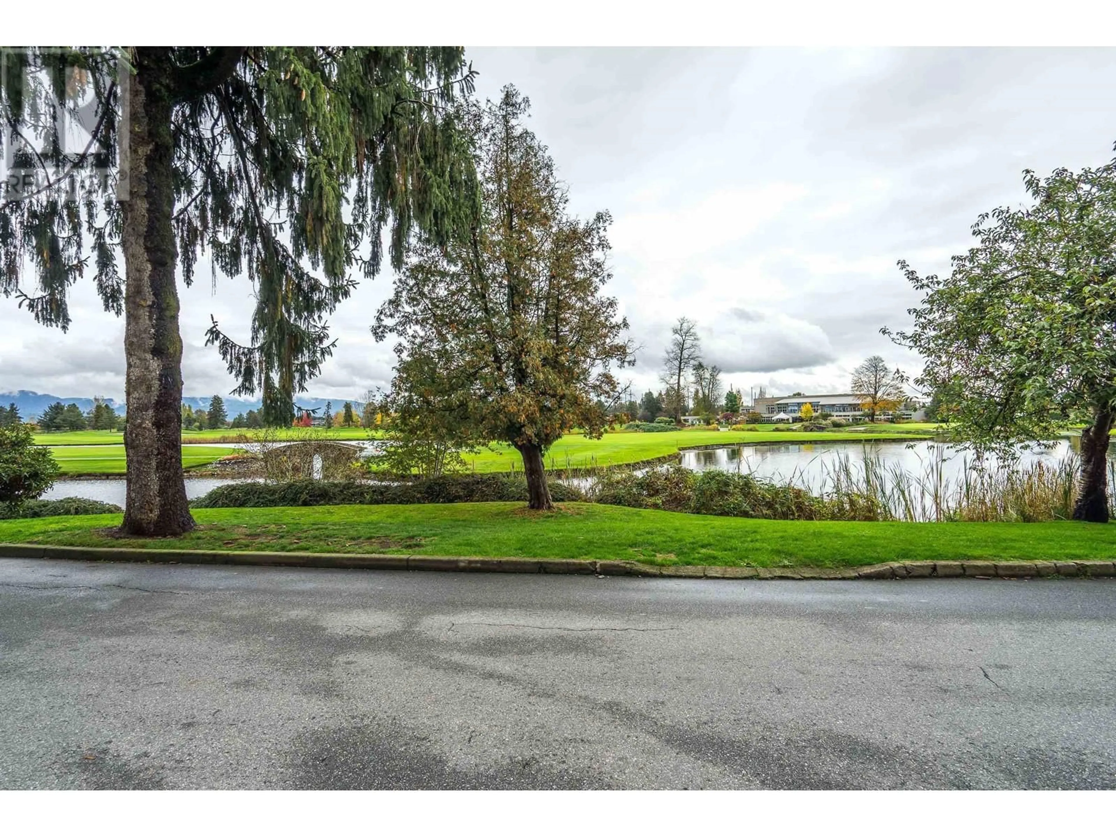 A pic from exterior of the house or condo, the street view for 311 19677 MEADOW GARDENS WAY, Pitt Meadows British Columbia V3Y0A2