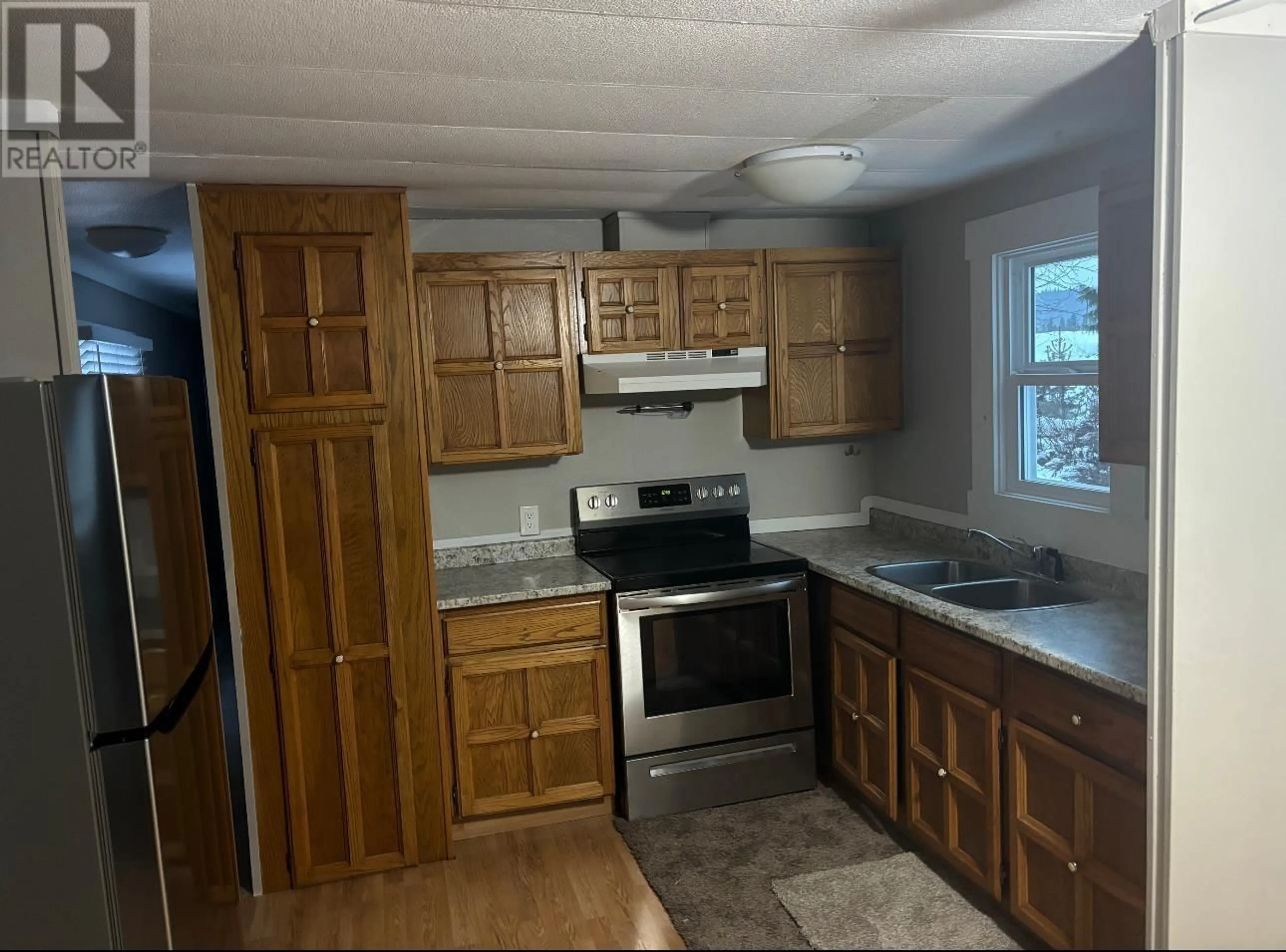 Standard kitchen, unknown floor, cottage for 21 5125 NORTH NECHAKO ROAD, Prince George British Columbia V2K4V7