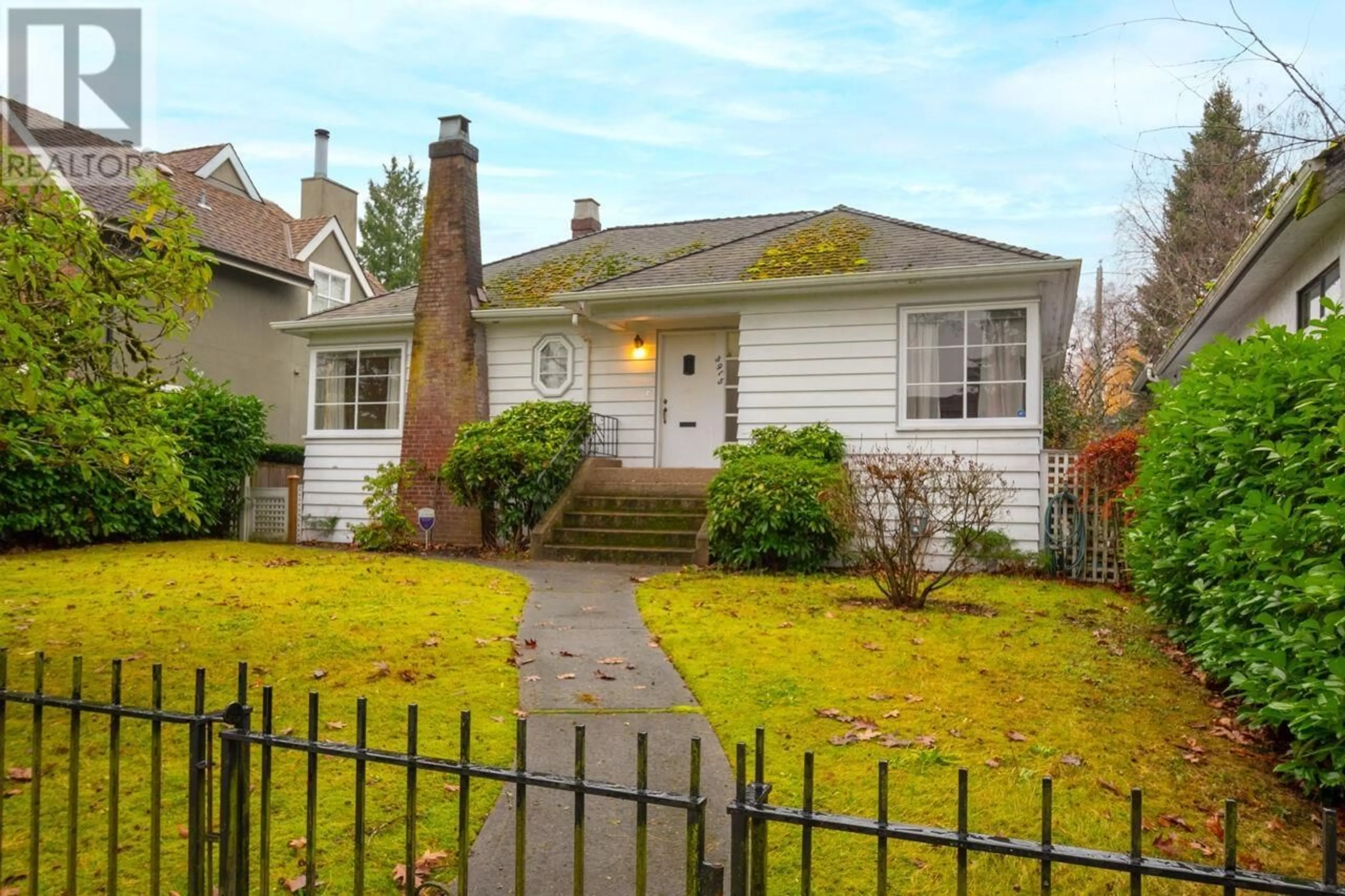 Frontside or backside of a home, the fenced backyard for 3915 W 32ND AVENUE, Vancouver British Columbia V6S1Z4