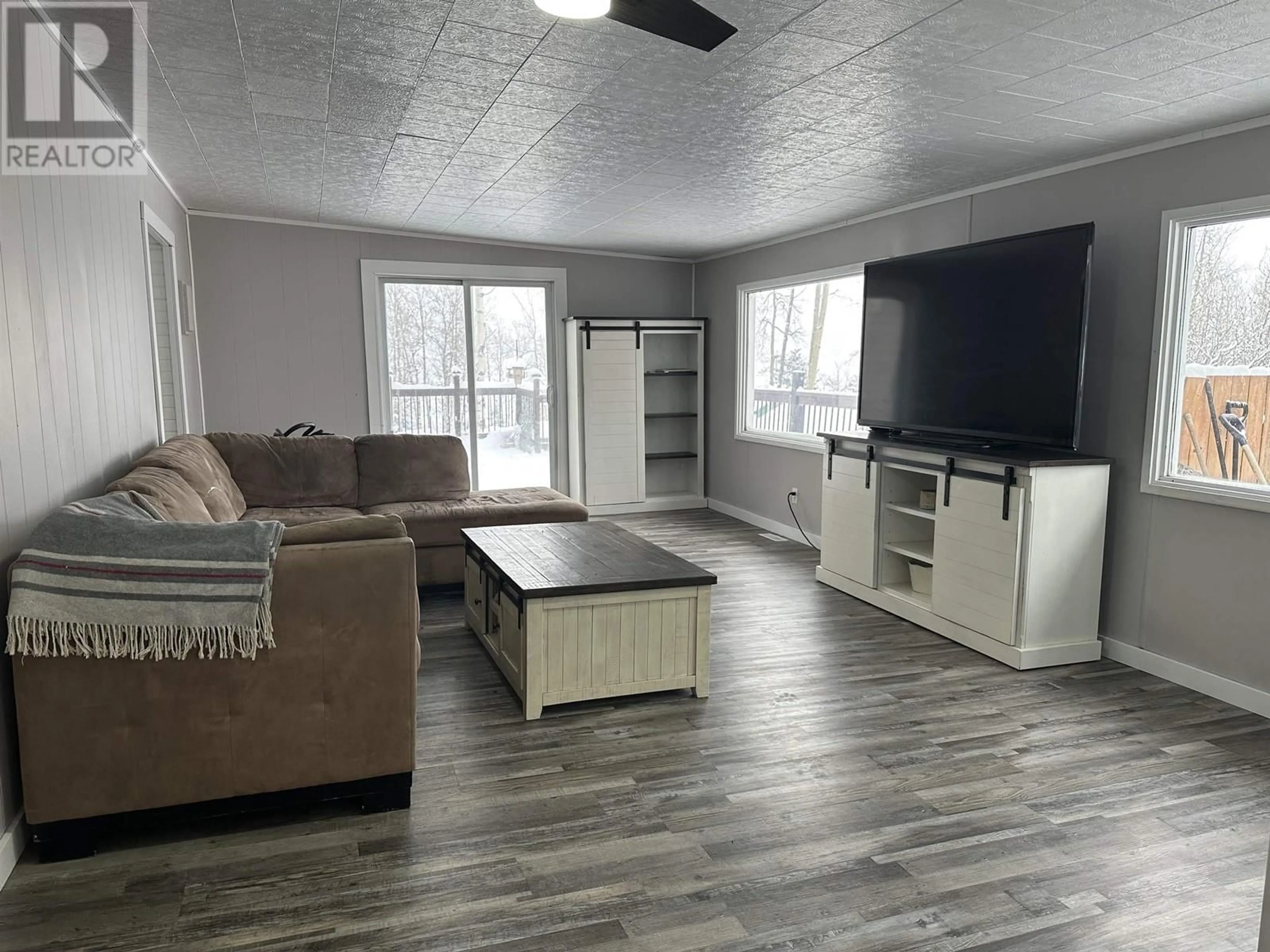 Living room, wood floors for 13239 CHARLIE LAKE CRESCENT, Charlie Lake British Columbia V1J8G1