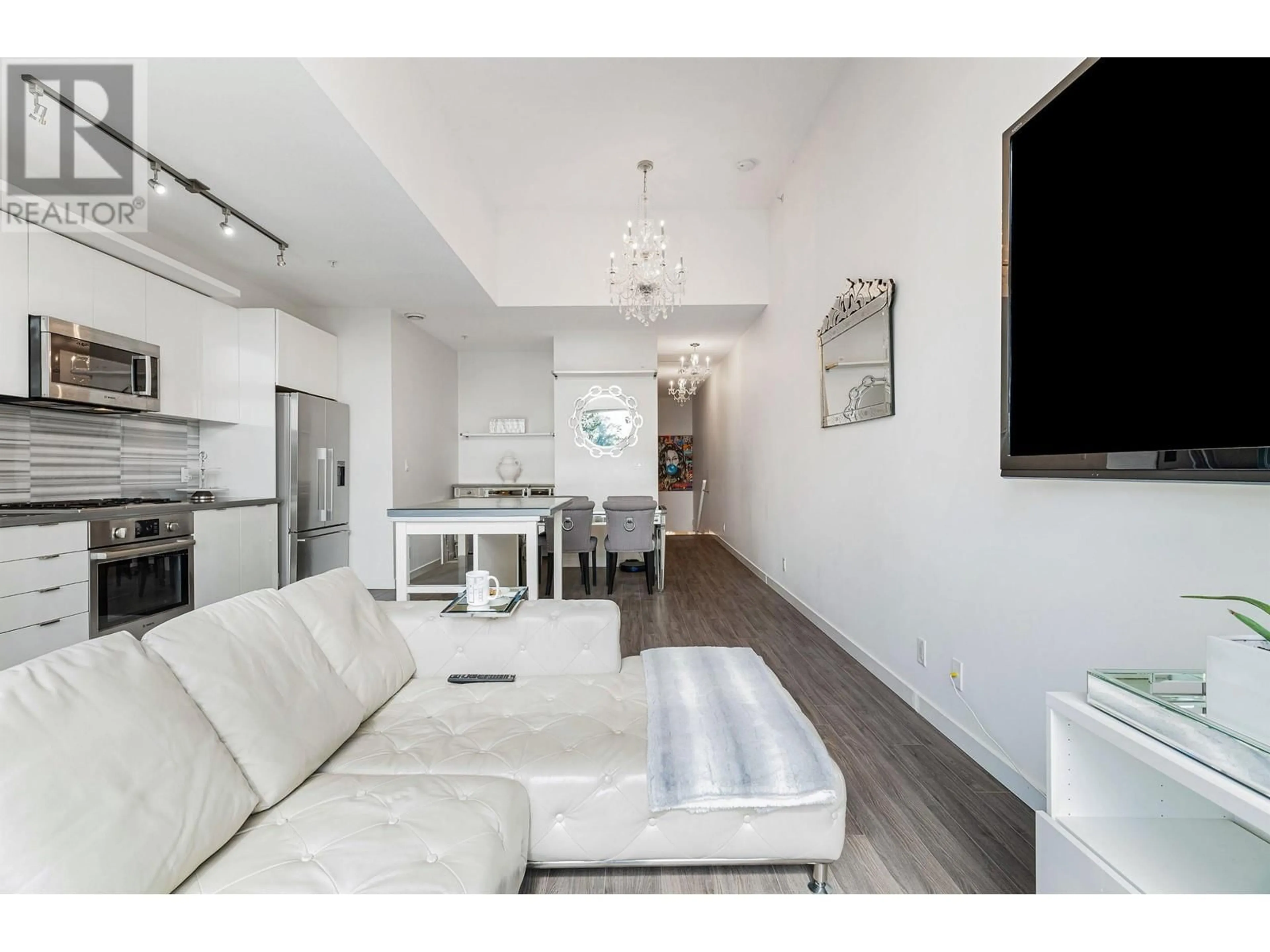 Living room, wood floors for 312 3138 RIVERWALK AVENUE, Vancouver British Columbia V5S0B6