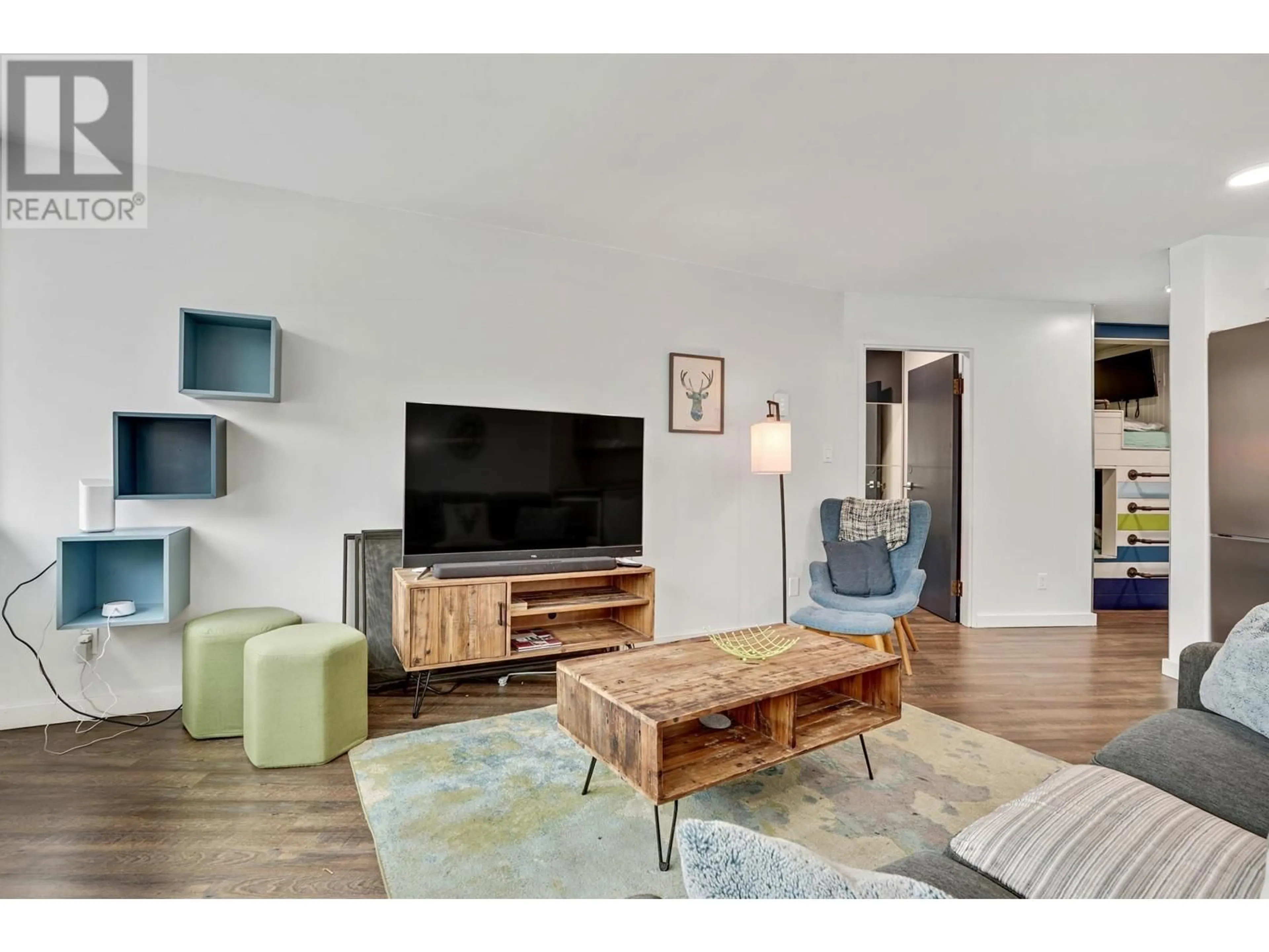 Living room with furniture, wood/laminate floor for 202 - 4111 GOLFERS APPROACH, Whistler British Columbia V8E1A4