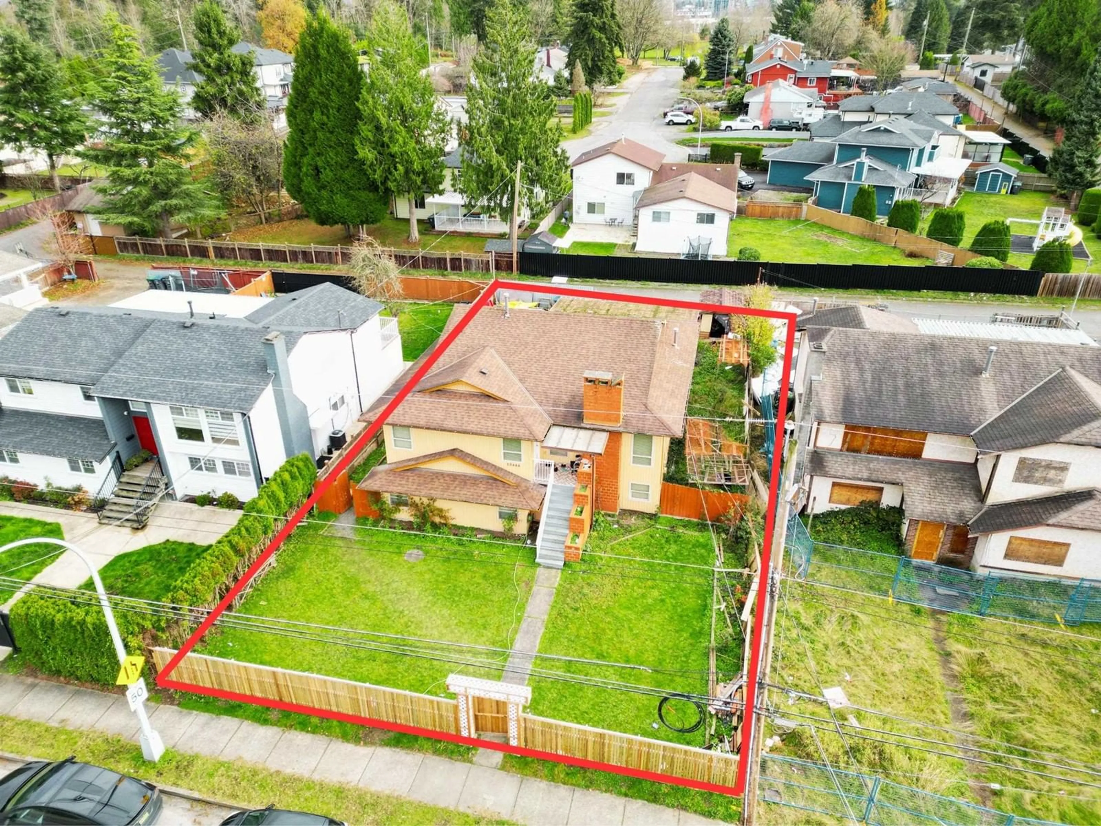 Frontside or backside of a home, the fenced backyard for 10444 128 STREET, Surrey British Columbia V3T5J1