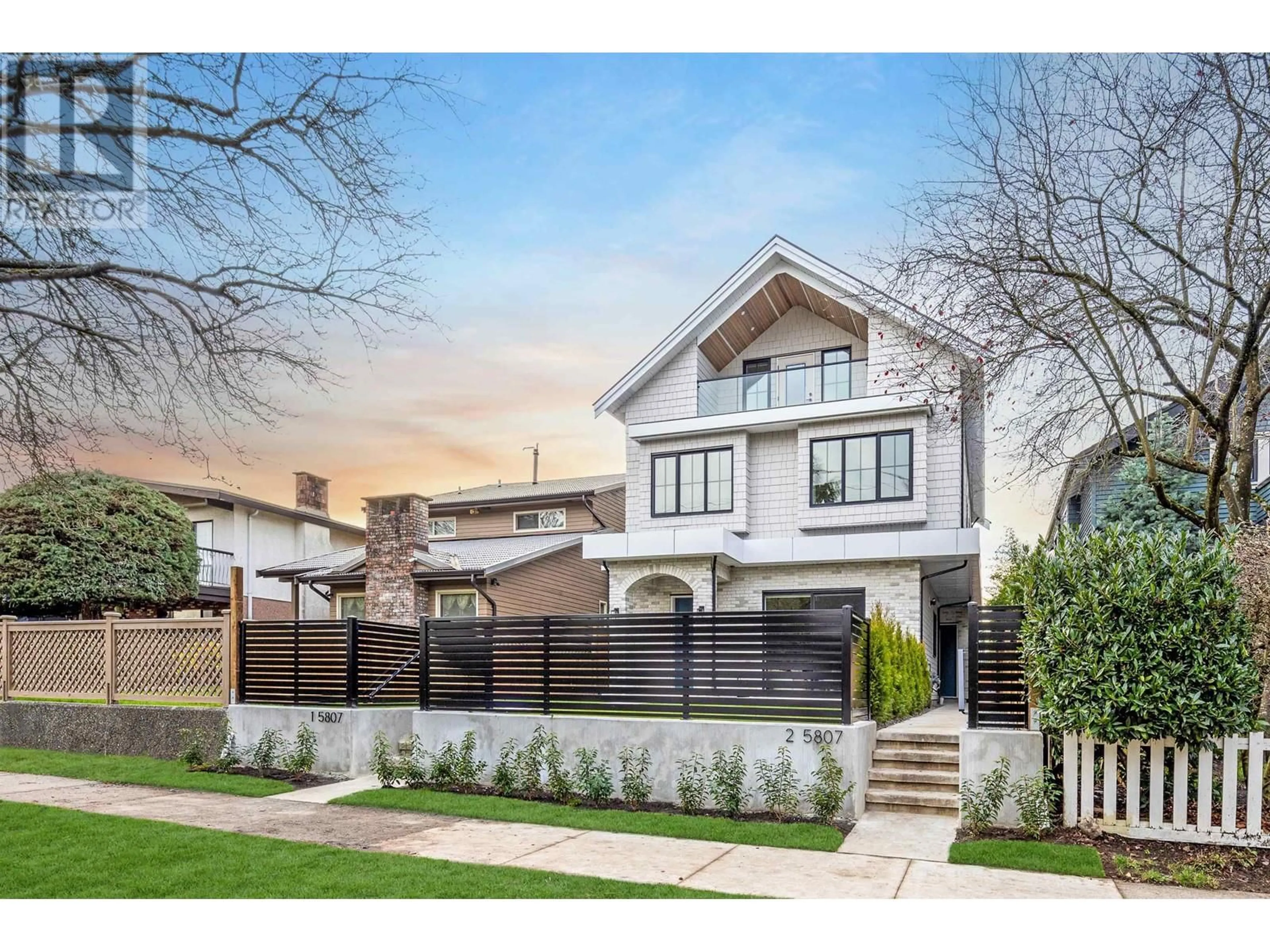 Frontside or backside of a home, the fenced backyard for 1 5807 PRINCE EDWARD STREET, Vancouver British Columbia V5W2X8