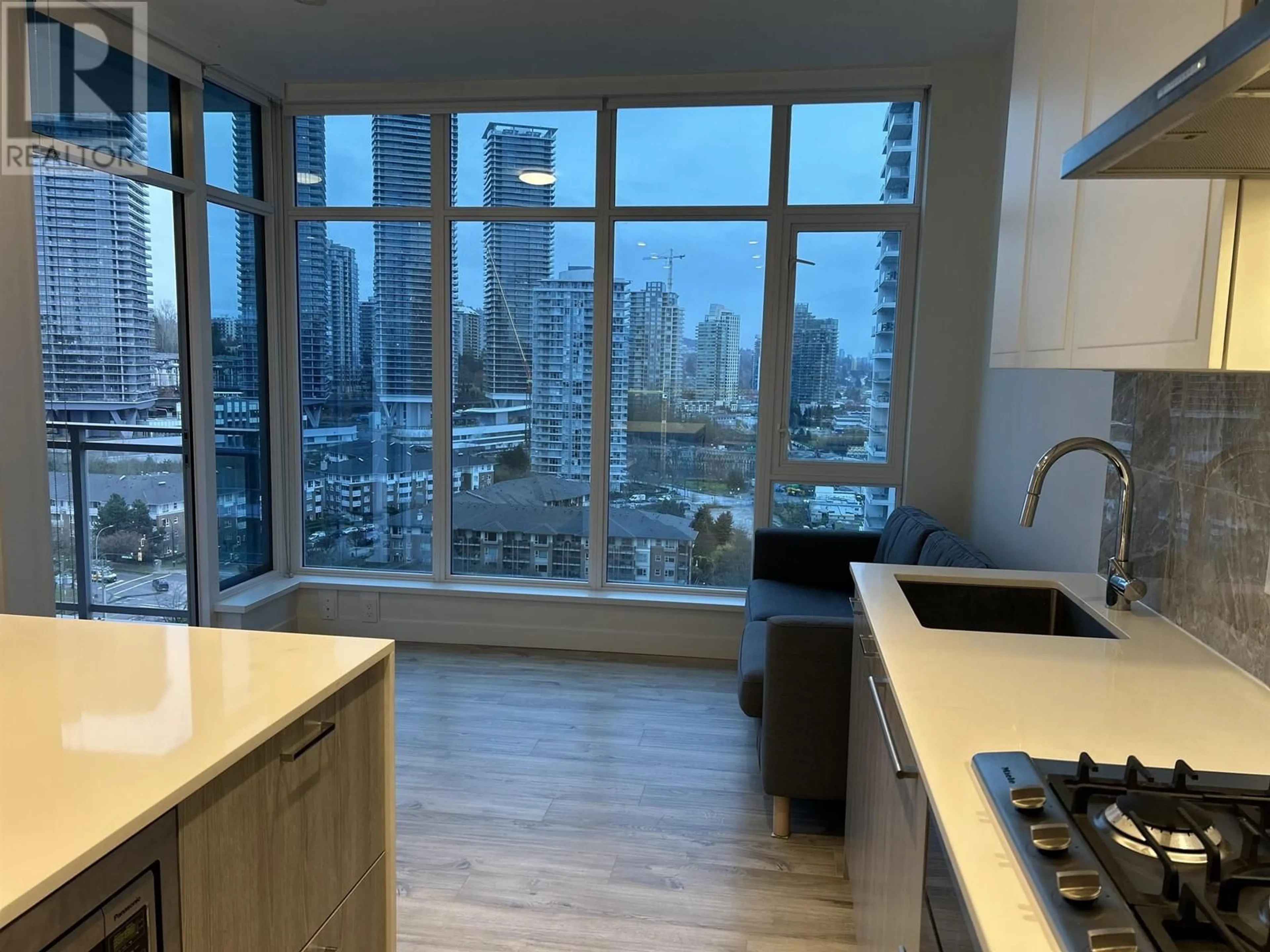 Standard kitchen, wood floors, the view of city buildings for 1308 2288 ALPHA AVENUE, Burnaby British Columbia V5C0L9