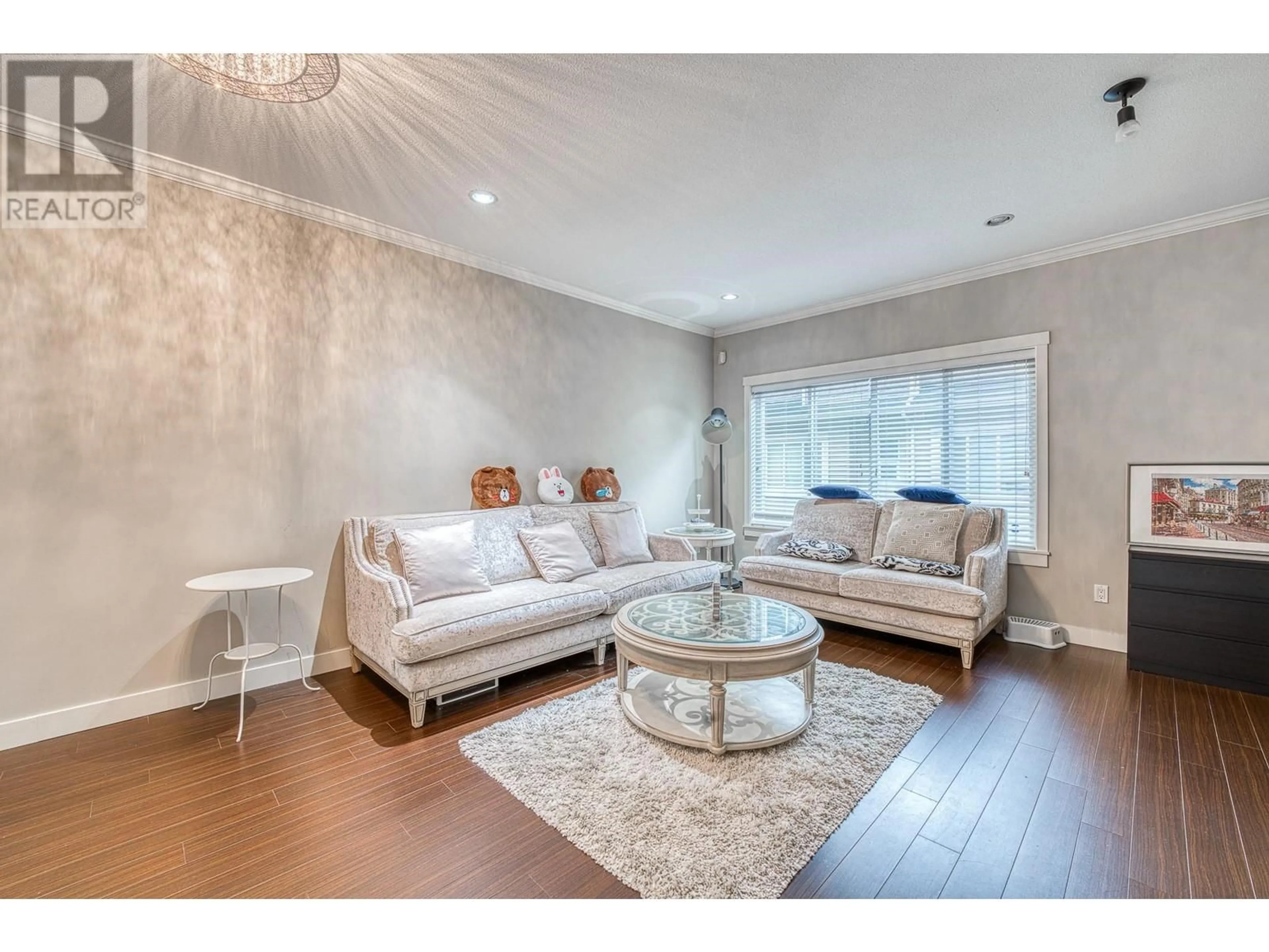 Living room with furniture, wood/laminate floor for 20 7051 ASH STREET, Richmond British Columbia V6Y2R9