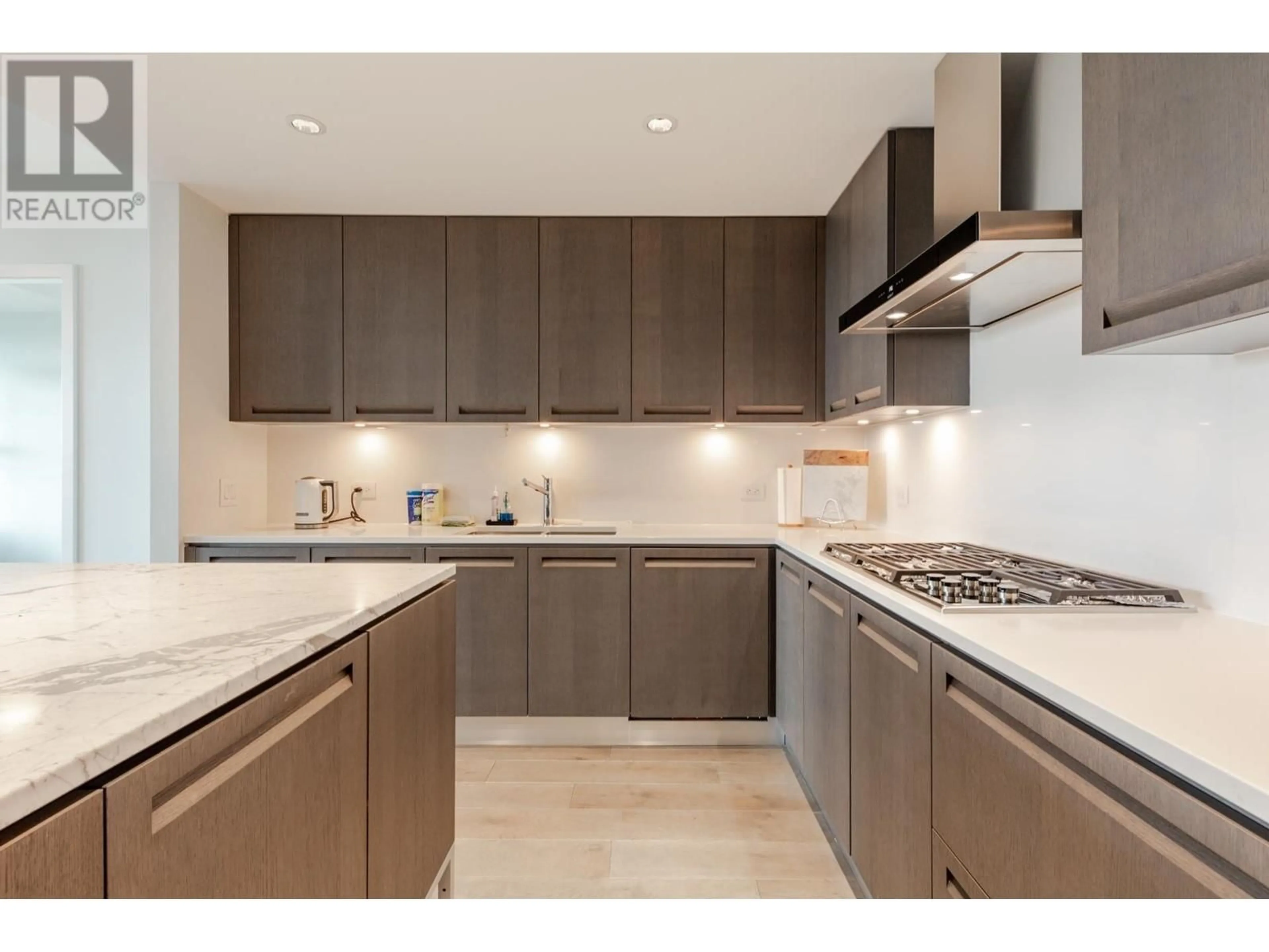 Contemporary kitchen, wood floors for 310 2102 W 48TH AVENUE, Vancouver British Columbia V6M2P5