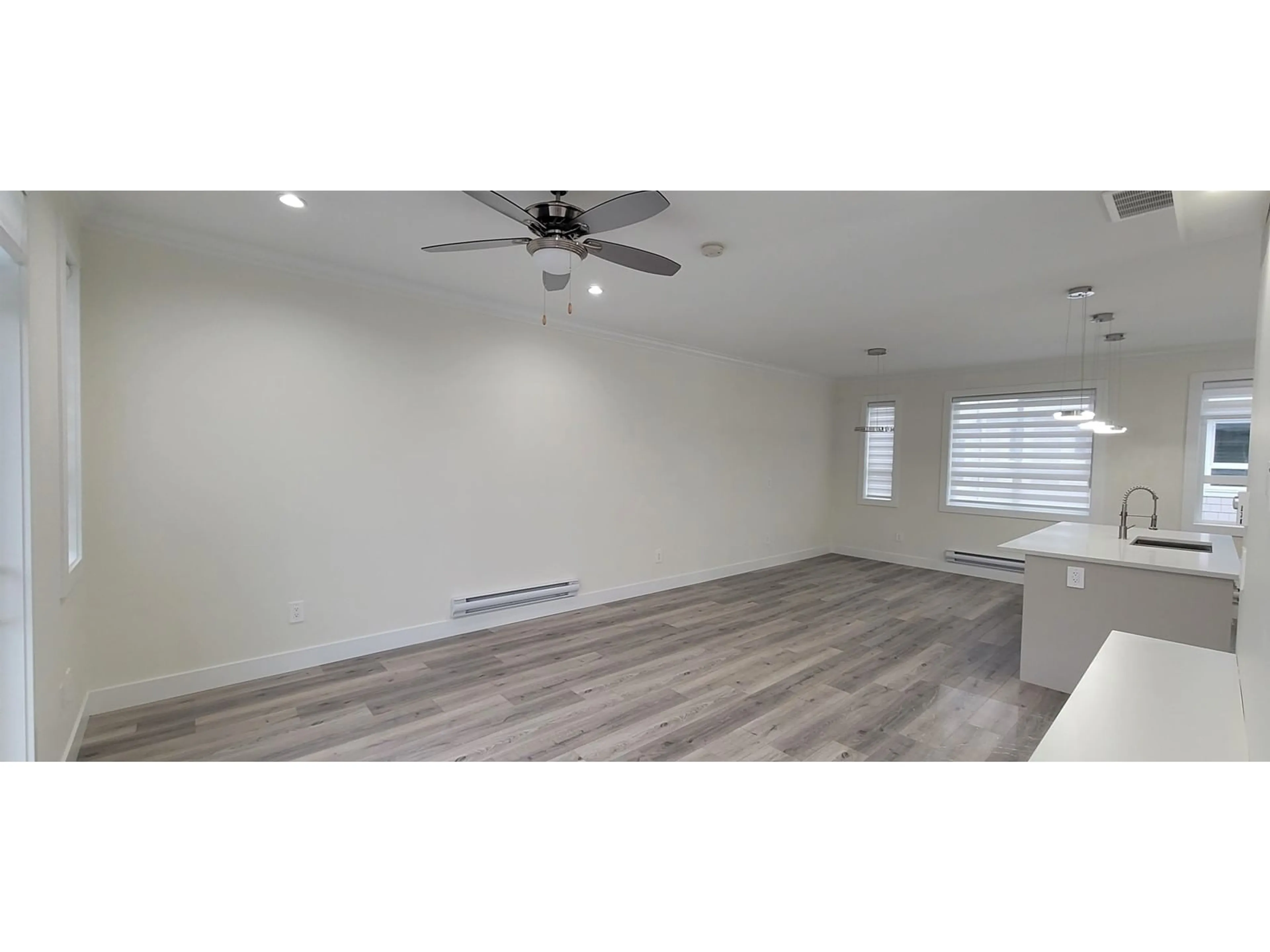 A pic of a room, wood floors for 11 8181 135A STREET, Surrey British Columbia V3W3N8