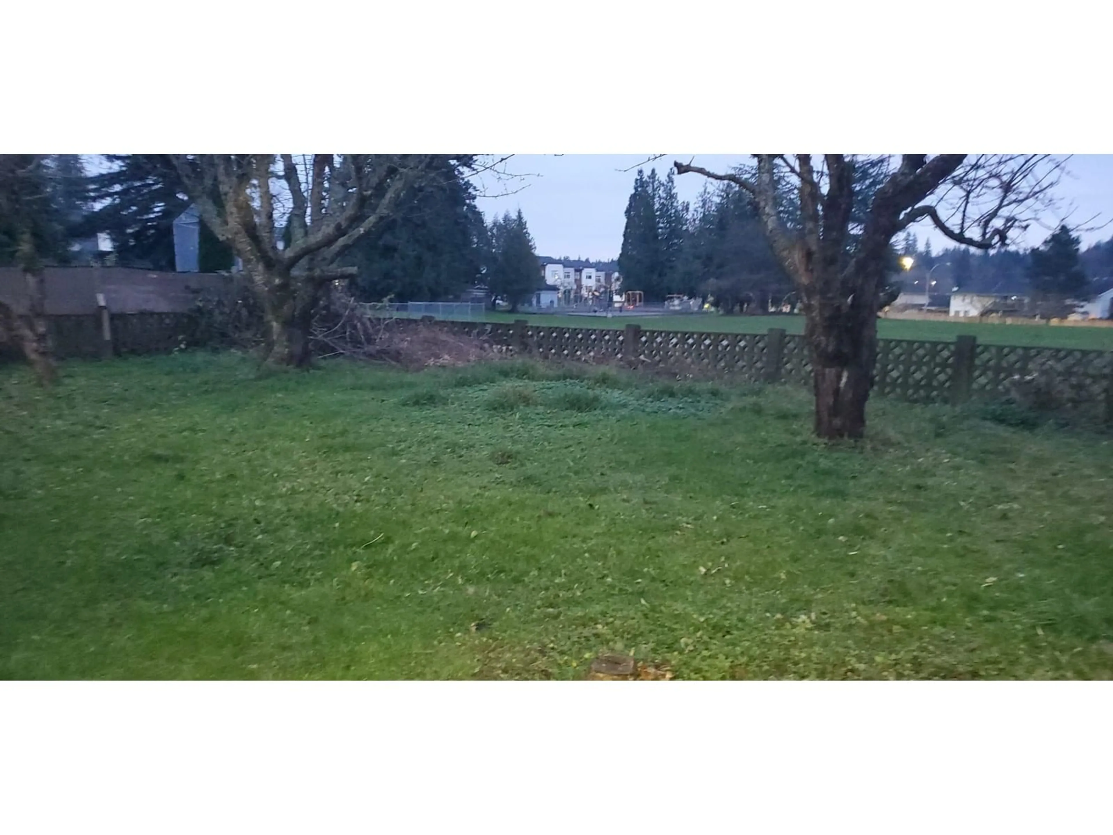 Frontside or backside of a home, the fenced backyard for 19750 54A AVENUE, Langley British Columbia V3A3W5