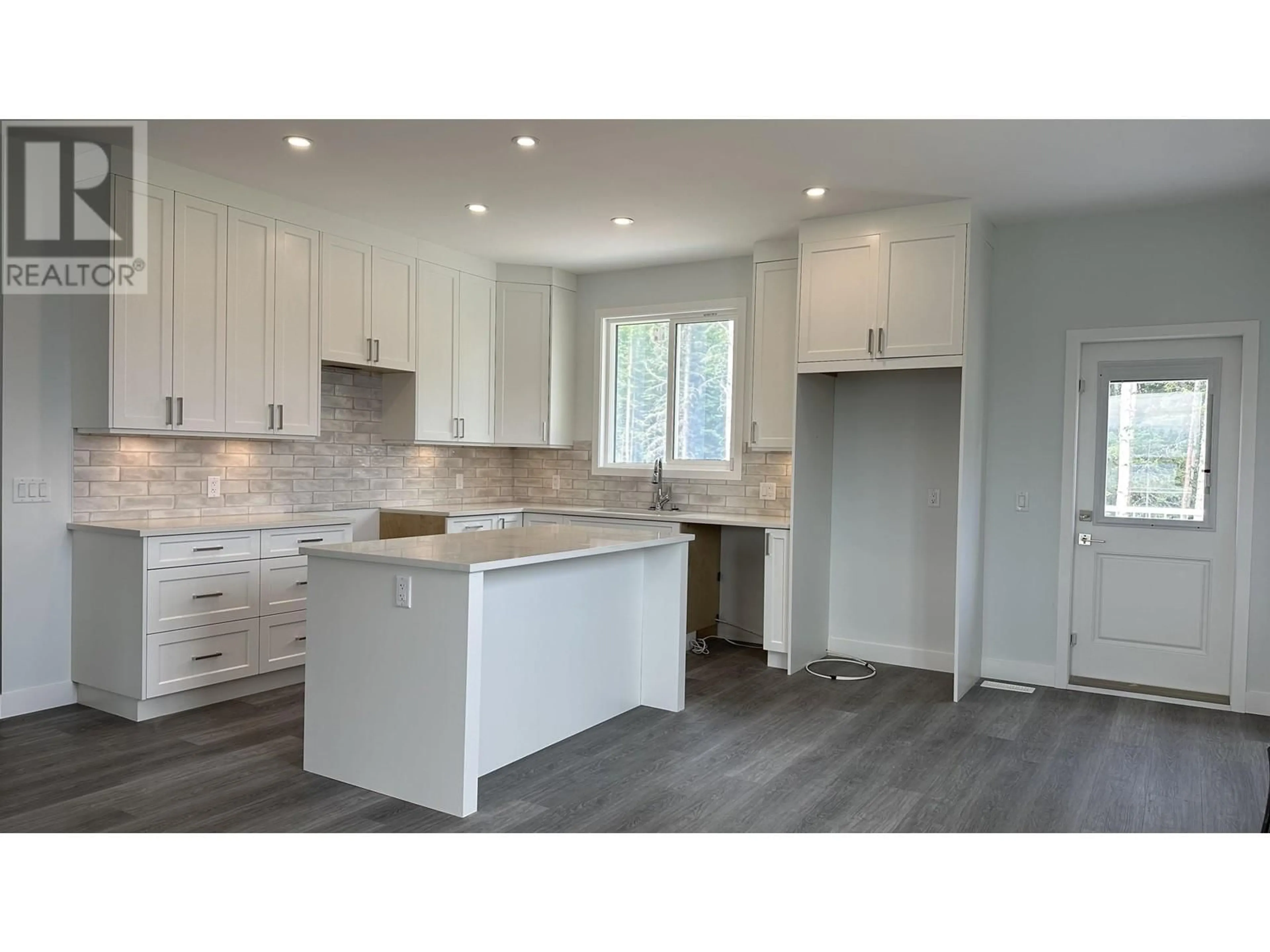 Open concept kitchen, wood/laminate floor for 7124 HILLU ROAD, Prince George British Columbia V2K0B4
