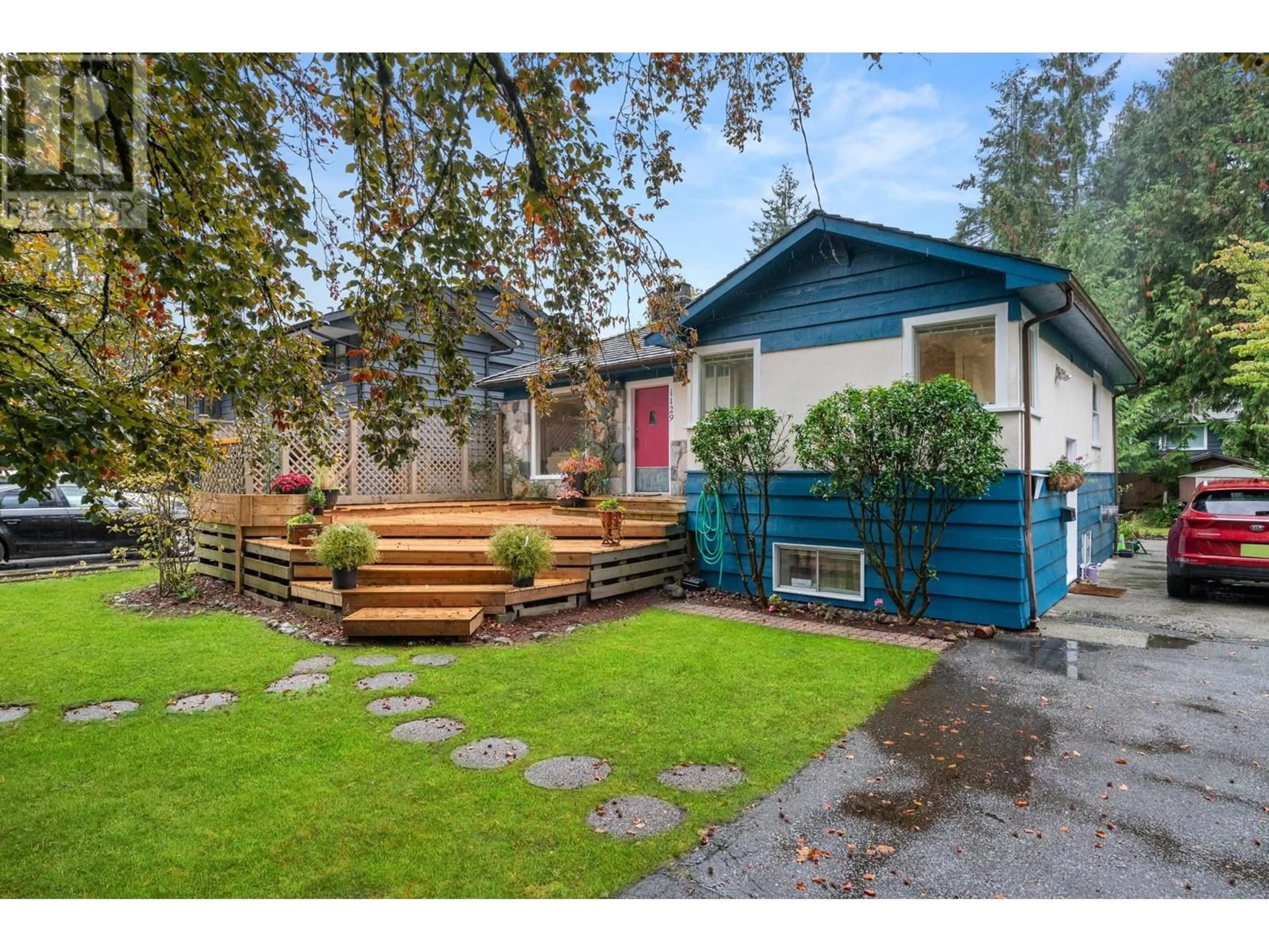 Frontside or backside of a home, the fenced backyard for 1129 W 24 STREET, North Vancouver British Columbia V7P2J1