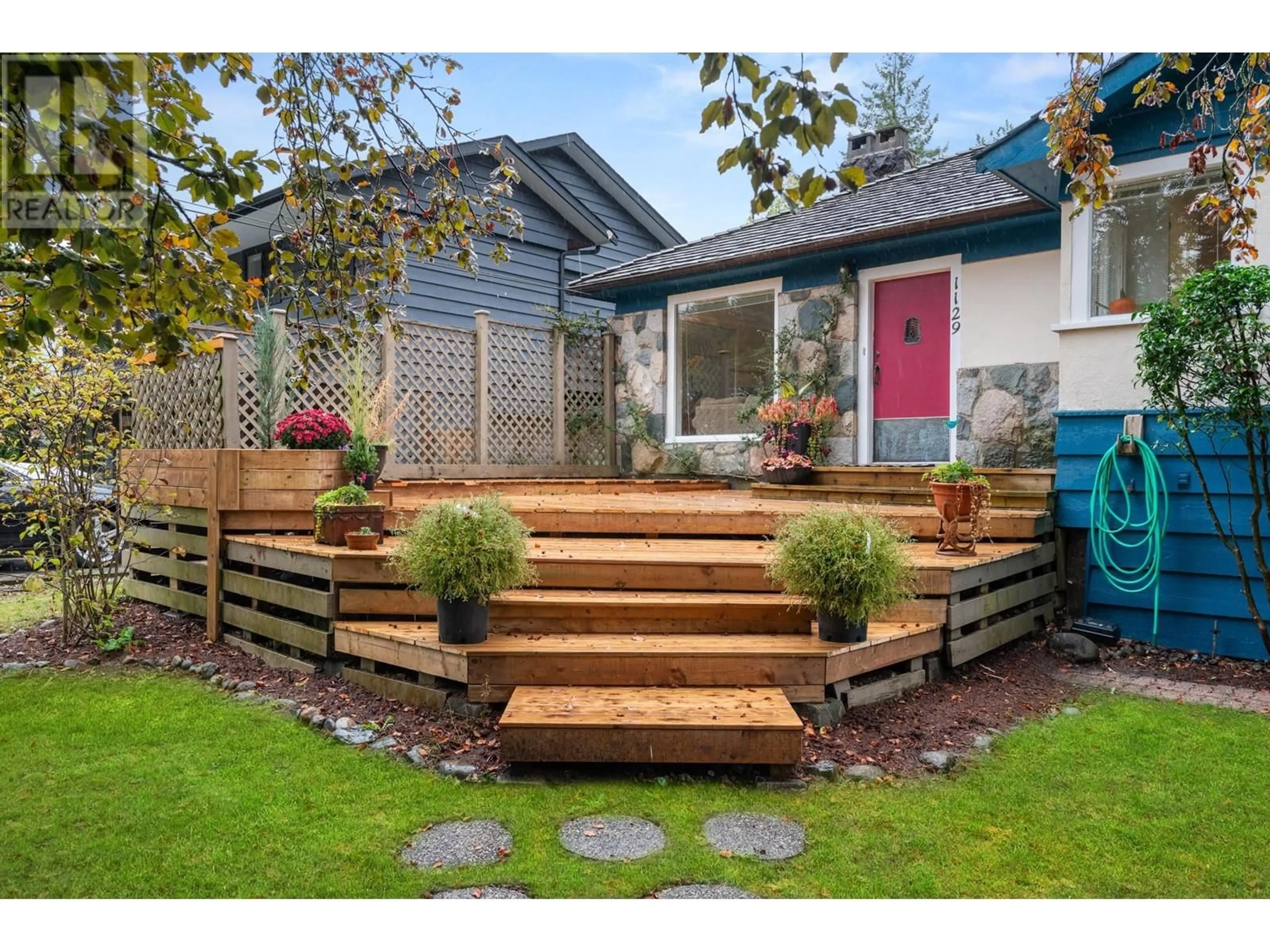 Frontside or backside of a home, the fenced backyard for 1129 W 24 STREET, North Vancouver British Columbia V7P2J1