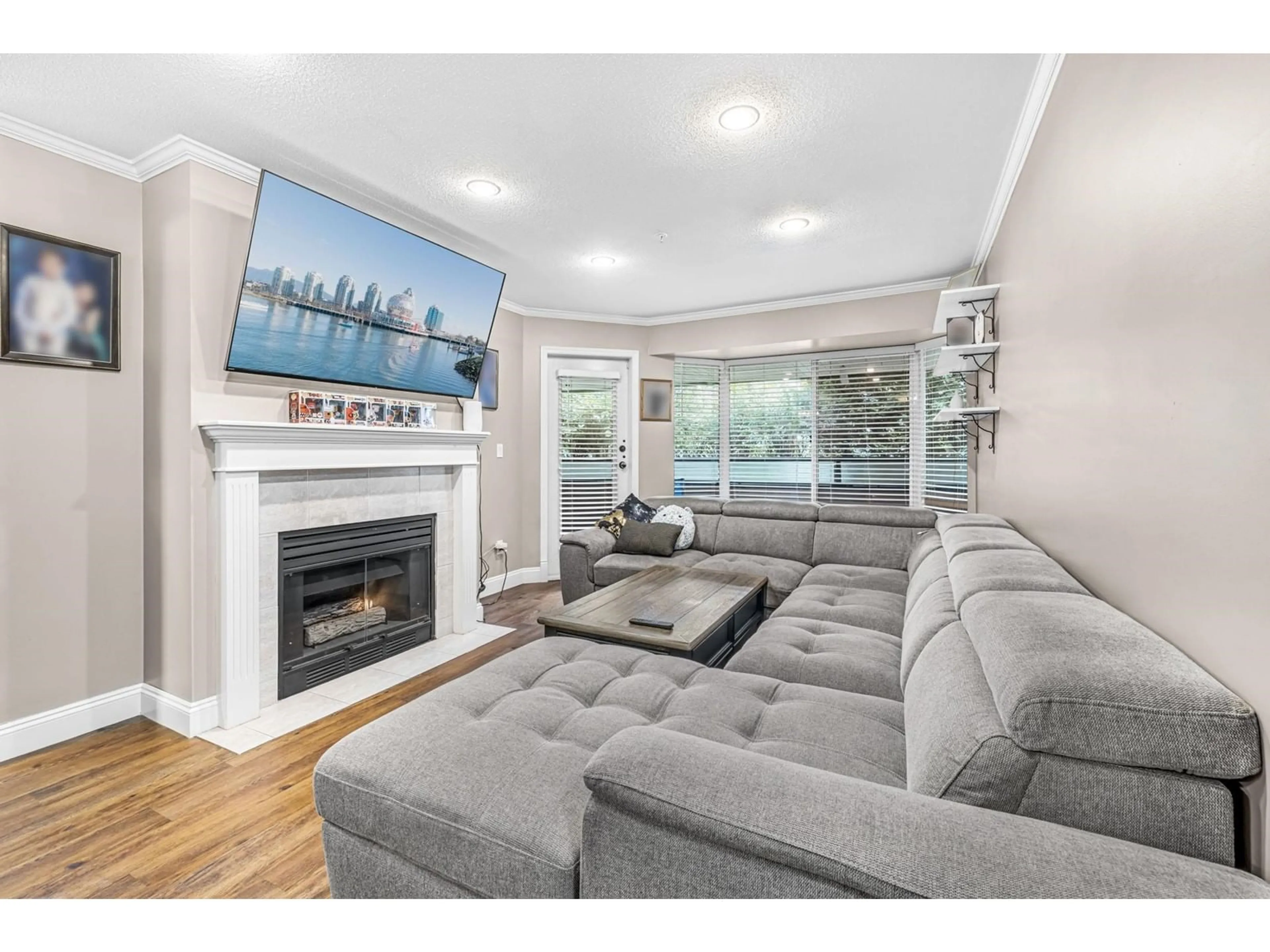 Living room, wood floors for 106 2958 TRETHEWEY STREET, Abbotsford British Columbia V2T6P6