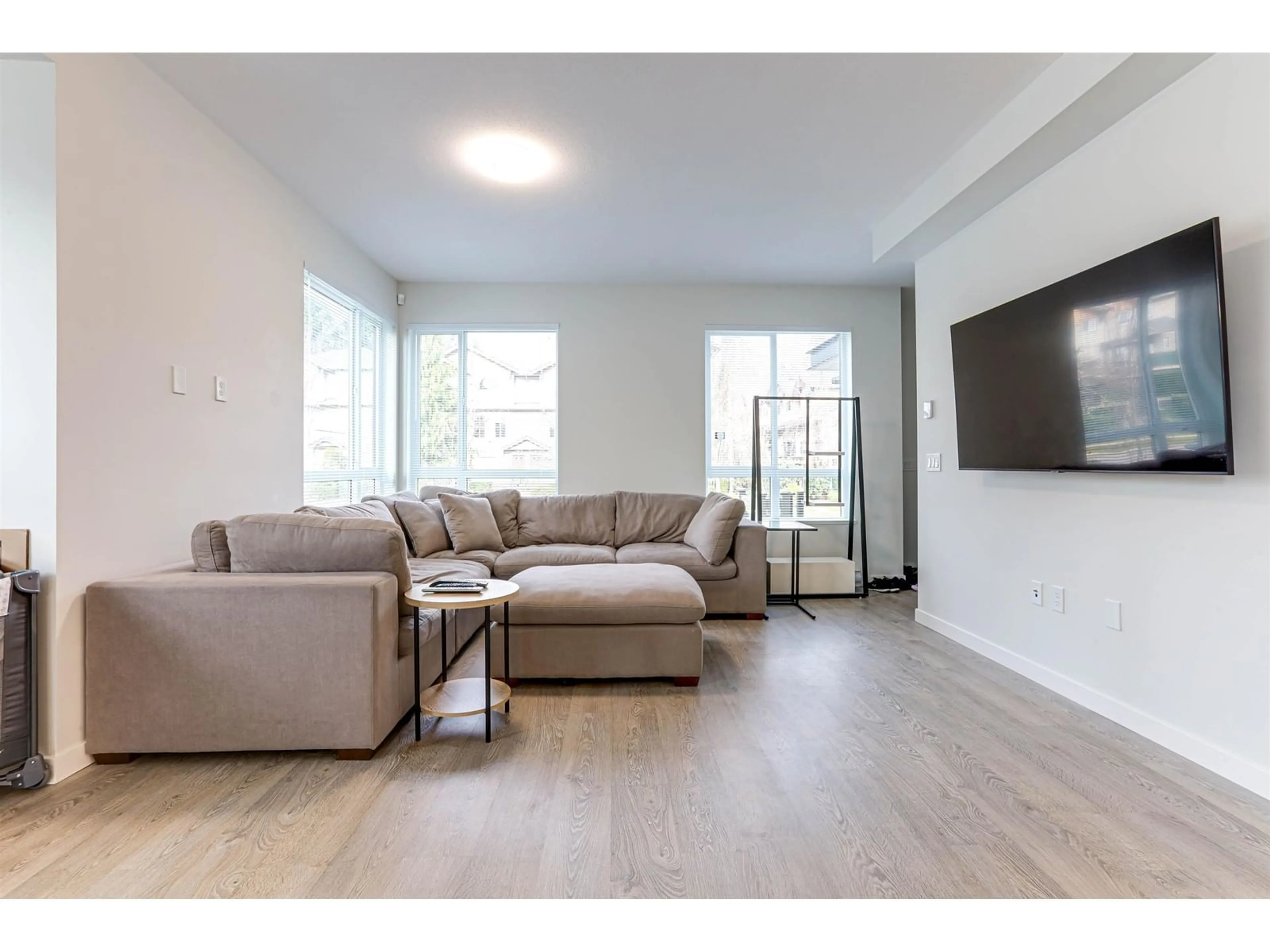 Living room with furniture, wood/laminate floor for 43 15151 EDMUND DRIVE, Surrey British Columbia V3S0B2