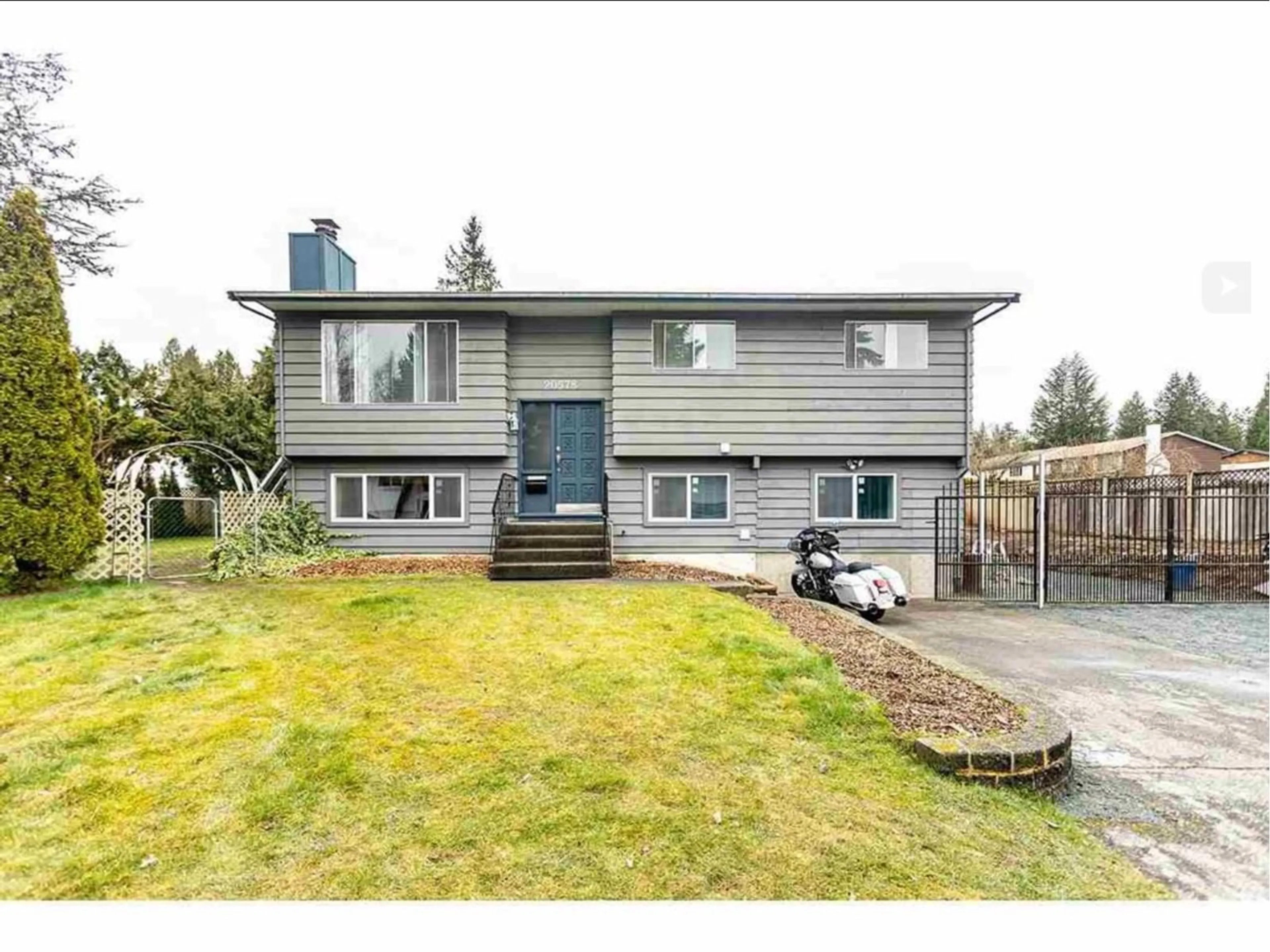 Frontside or backside of a home, the fenced backyard for 20578 48B AVENUE, Langley British Columbia V3A3P9