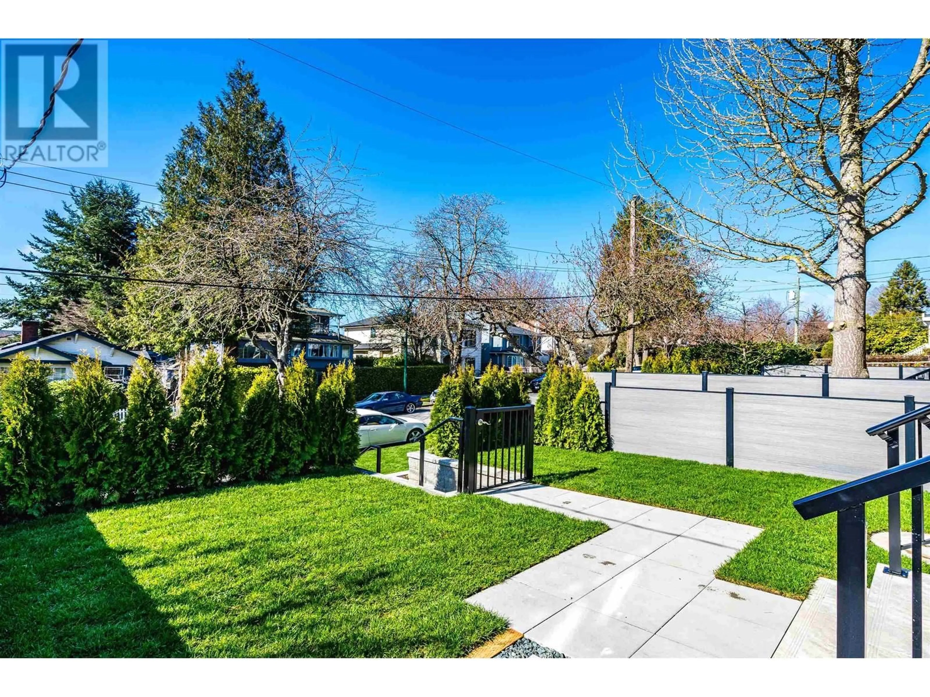 Frontside or backside of a home, the fenced backyard for 8192 CARTIER STREET, Vancouver British Columbia V6P4T5