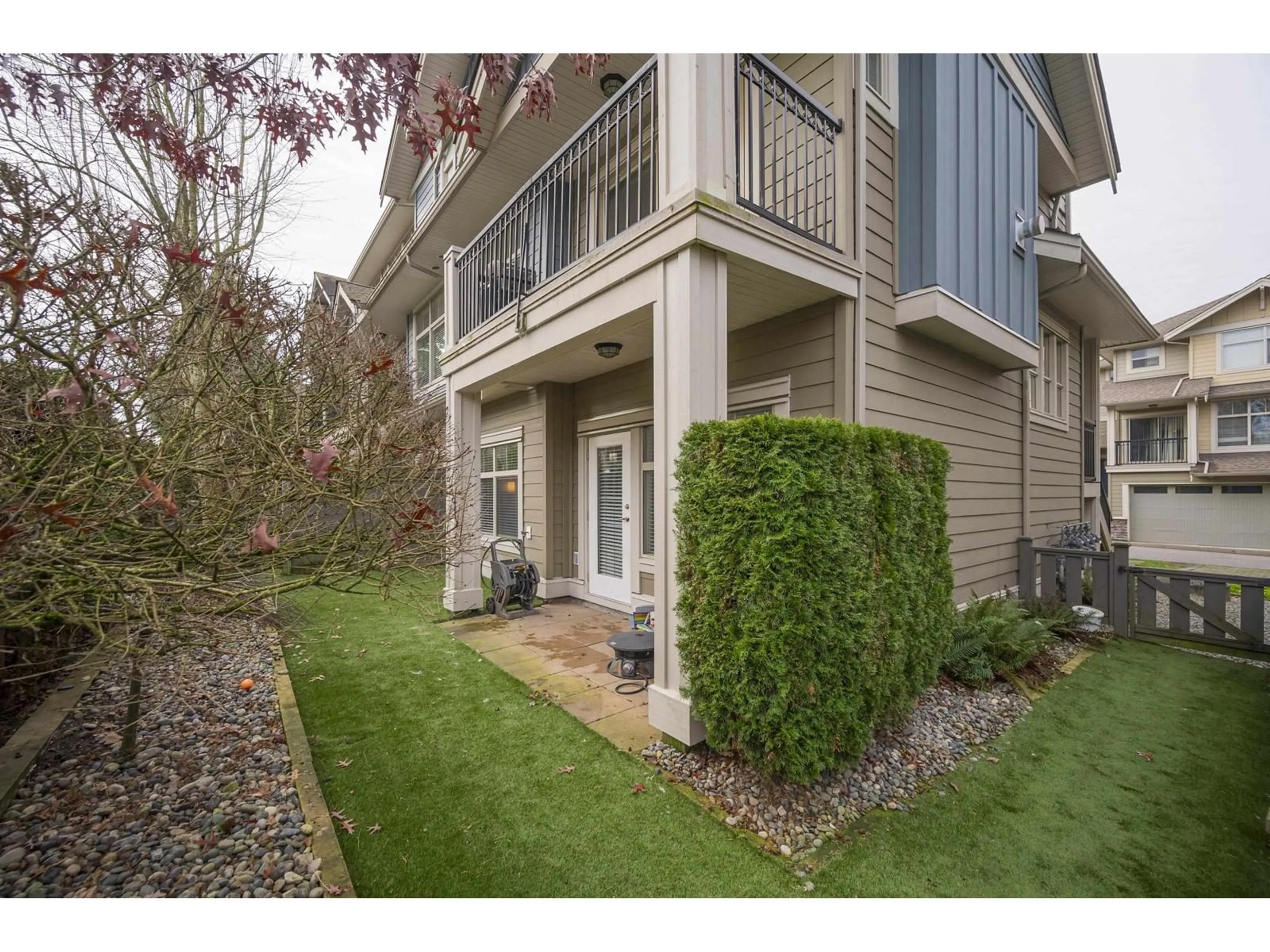 A pic from exterior of the house or condo, the fenced backyard for 66 22225 50 AVENUE, Langley British Columbia V2Y0G7