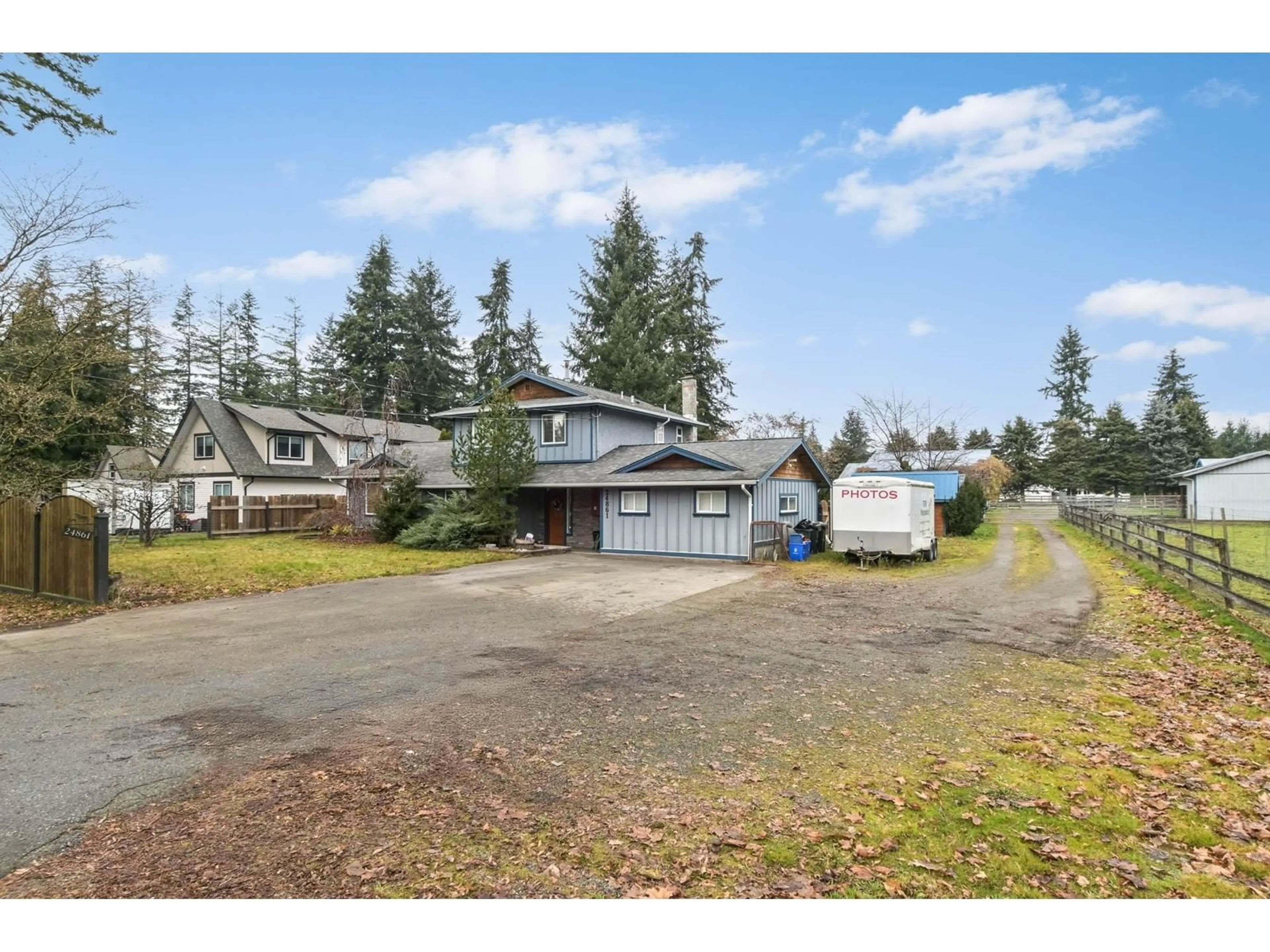 Frontside or backside of a home, the fenced backyard for 24861 56 AVENUE, Langley British Columbia V4W1G3