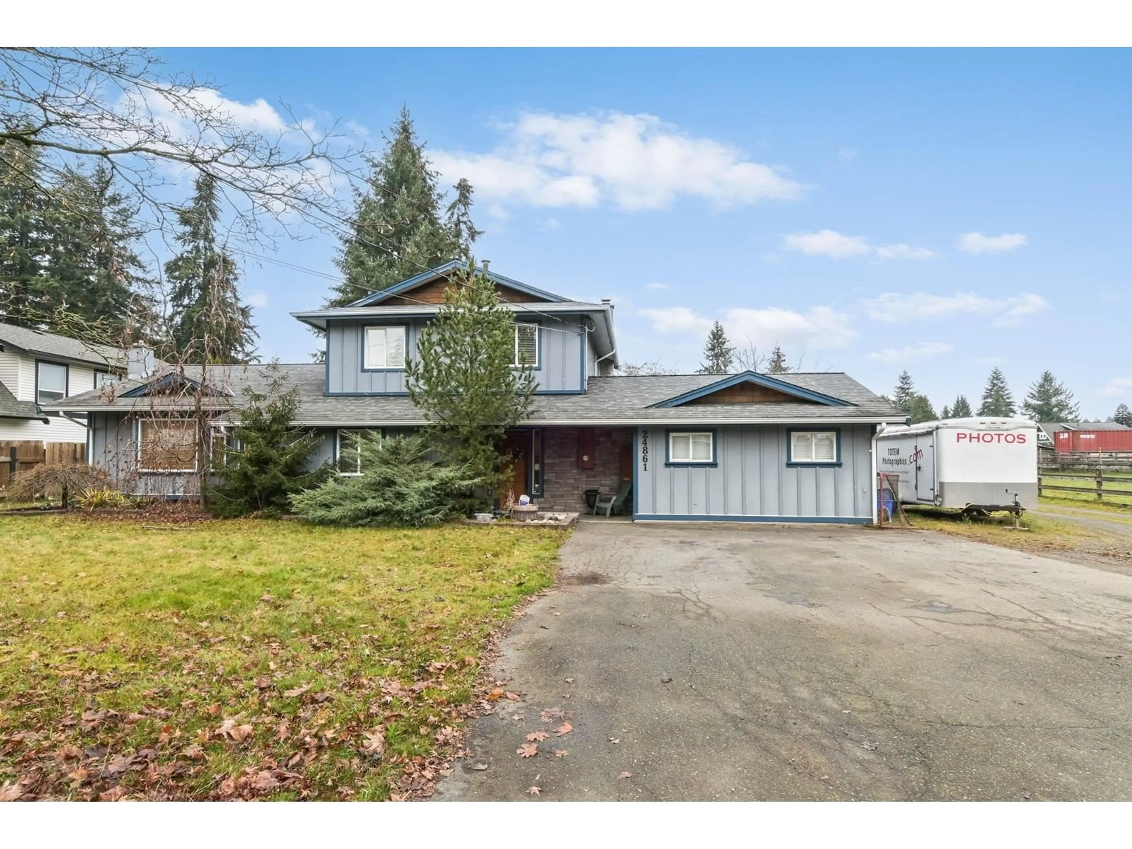 Frontside or backside of a home, the fenced backyard for 24861 56 AVENUE, Langley British Columbia V4W1G3