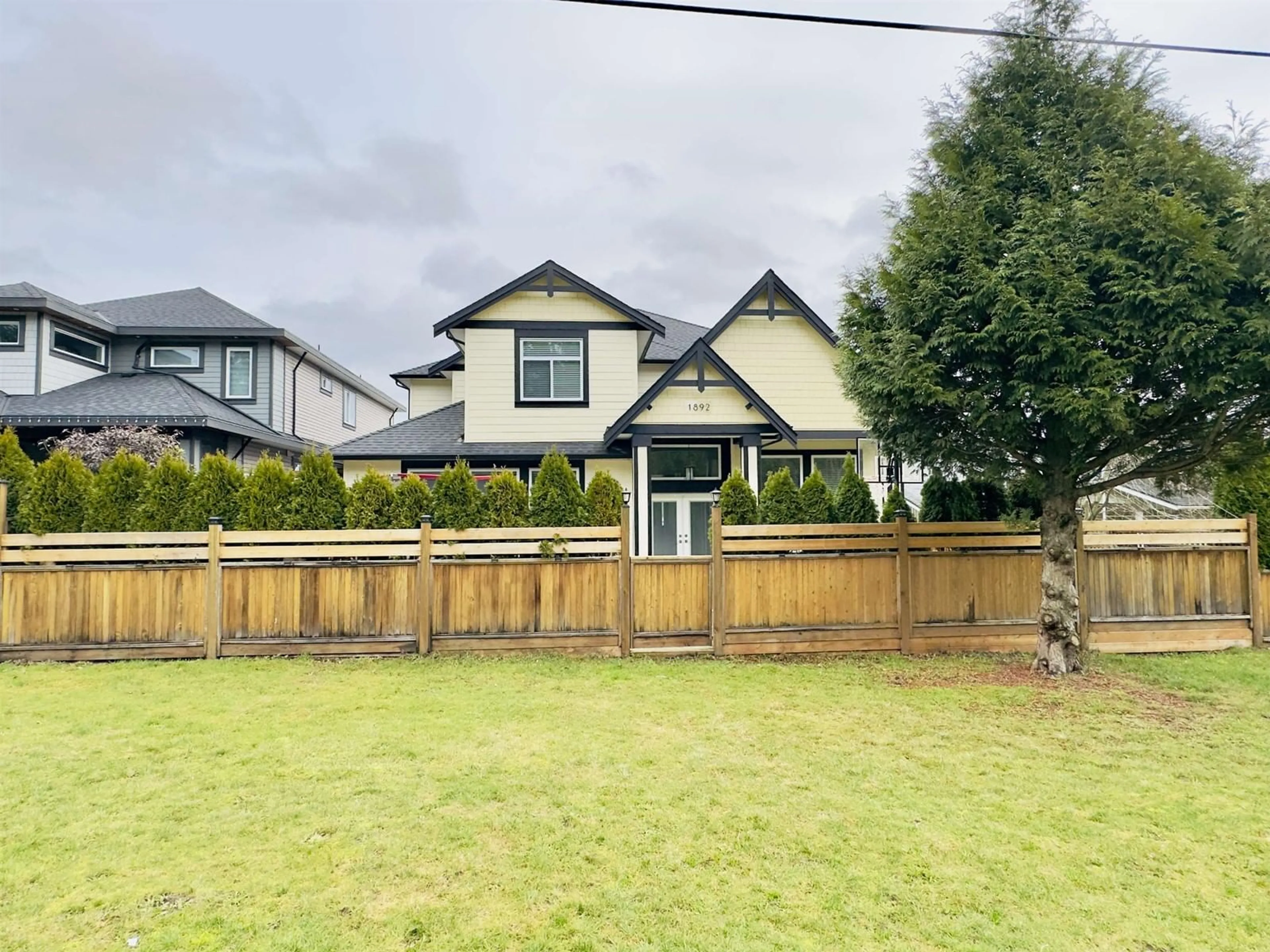 Frontside or backside of a home, the fenced backyard for 1892 KING GEORGE BOULEVARD, Surrey British Columbia V4A5A1